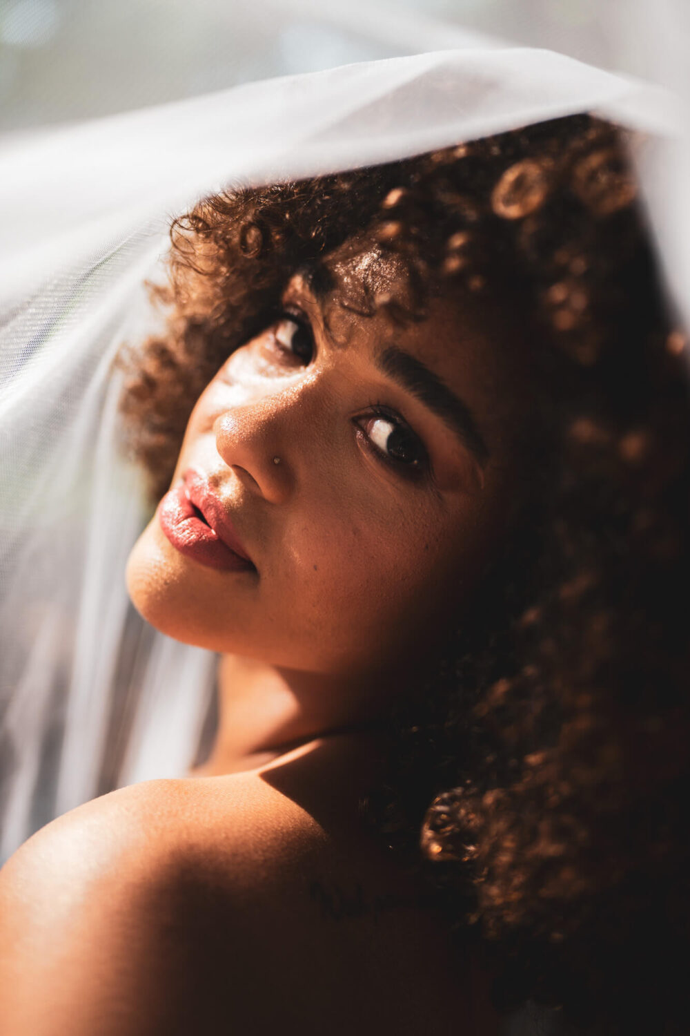 bride with veil draped over the head