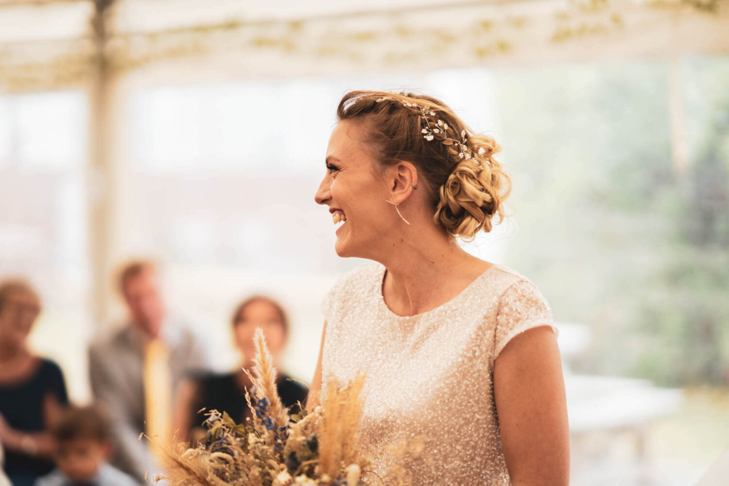 side portrait of bride laughing