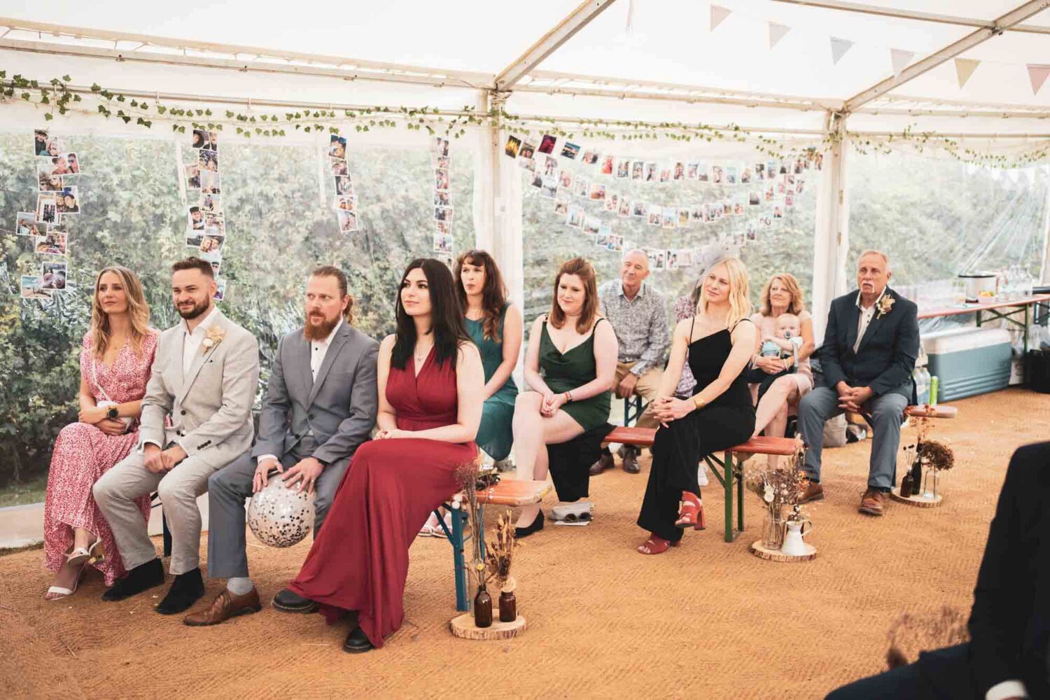 photo of guests sitting watching ceremony