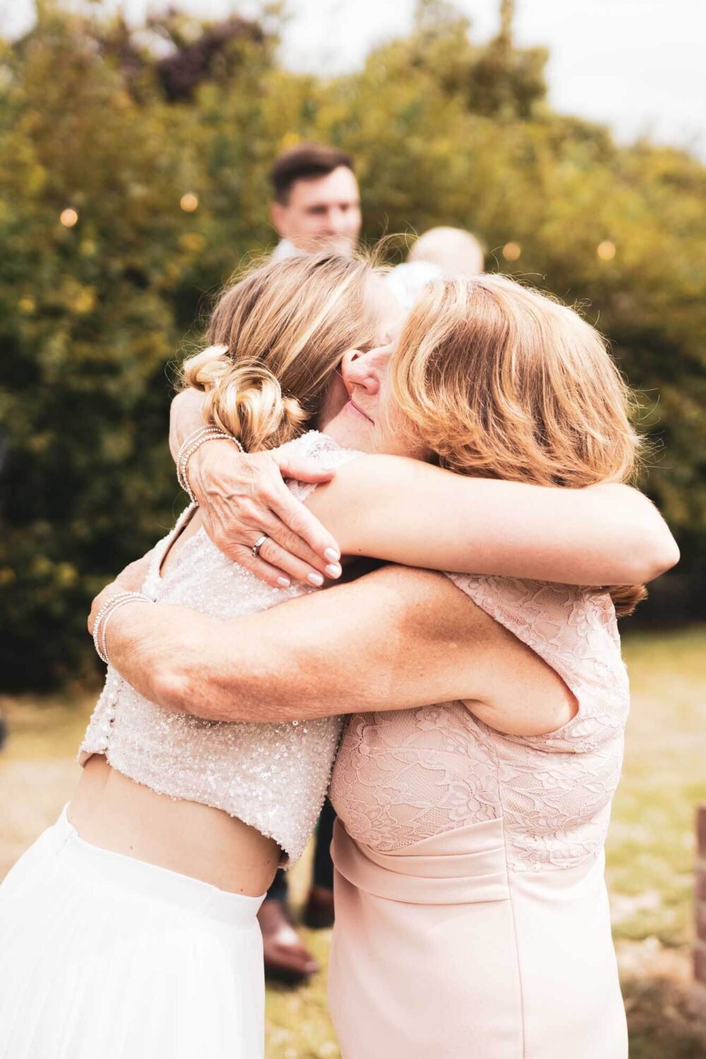 mum and daughter hugging