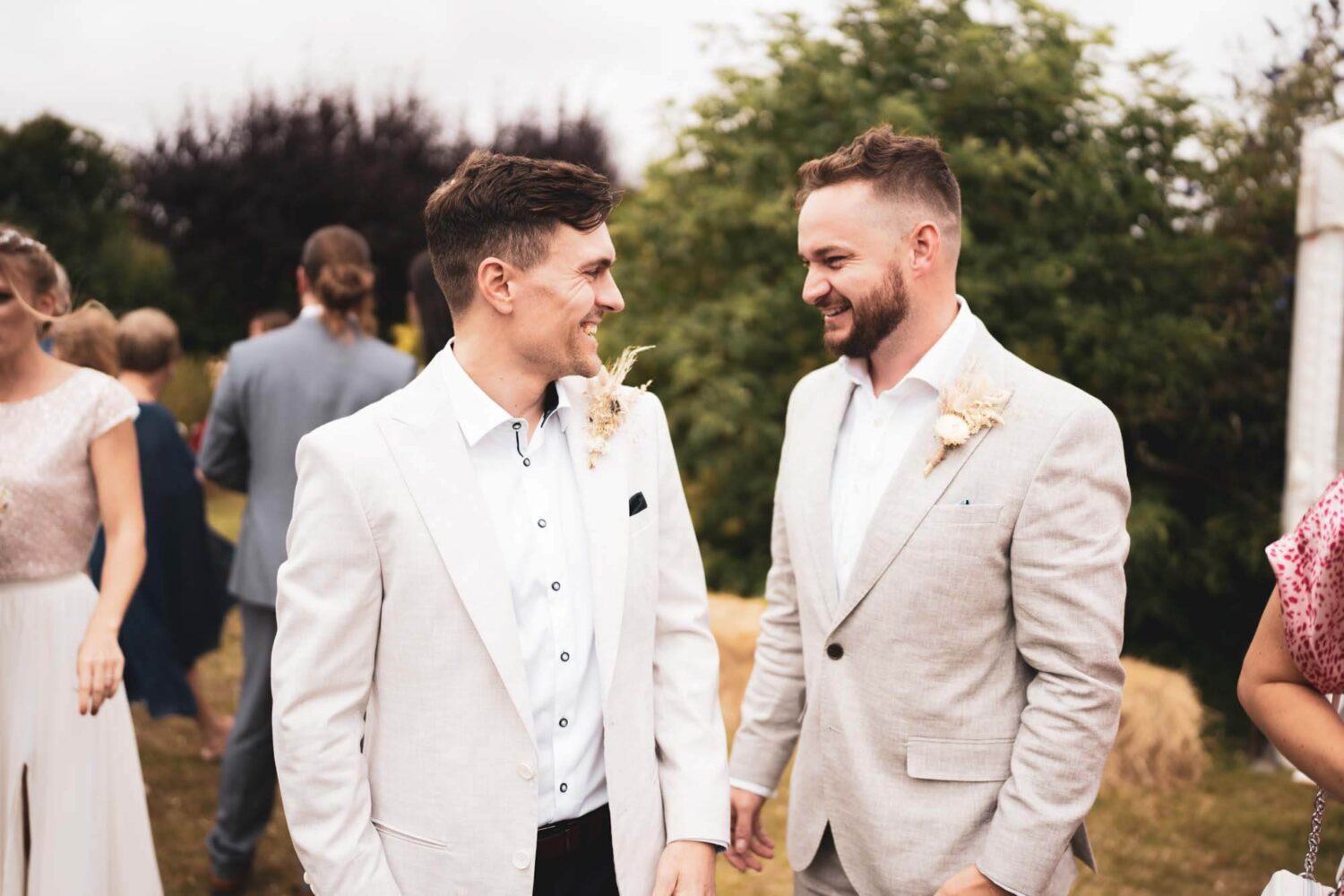 groom and best man chatting and laughing
