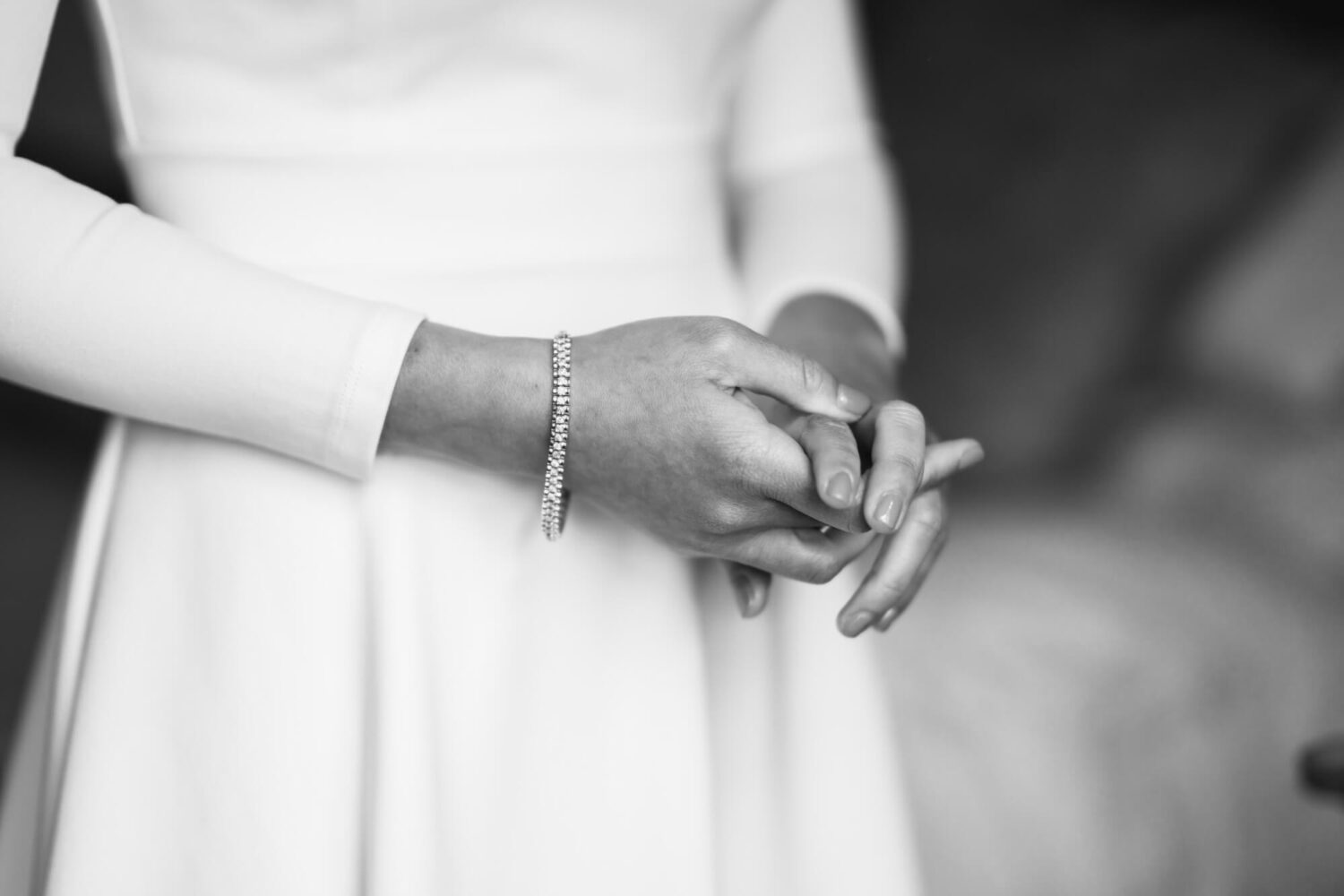 close up of bride's wrist with hands inter locked