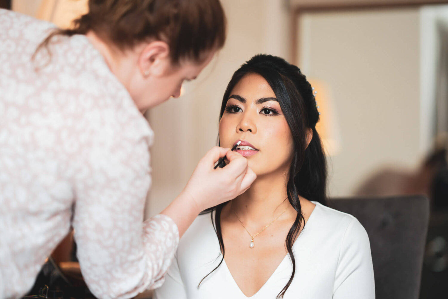 bride having last make up touch ups