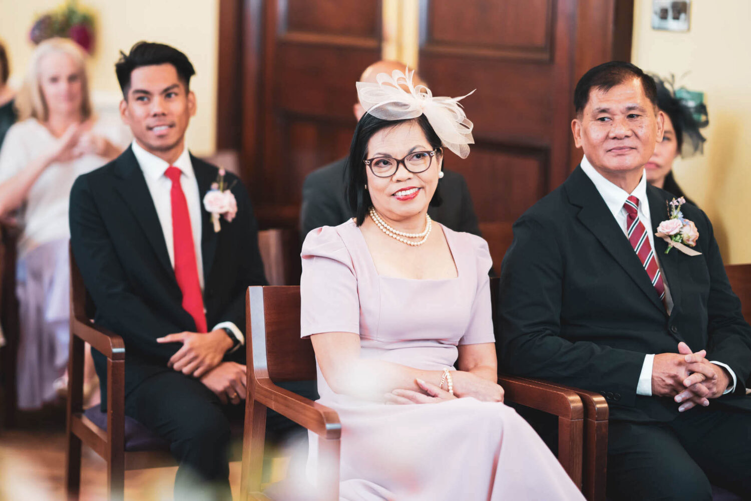 mother of the bride smiling during ceremony