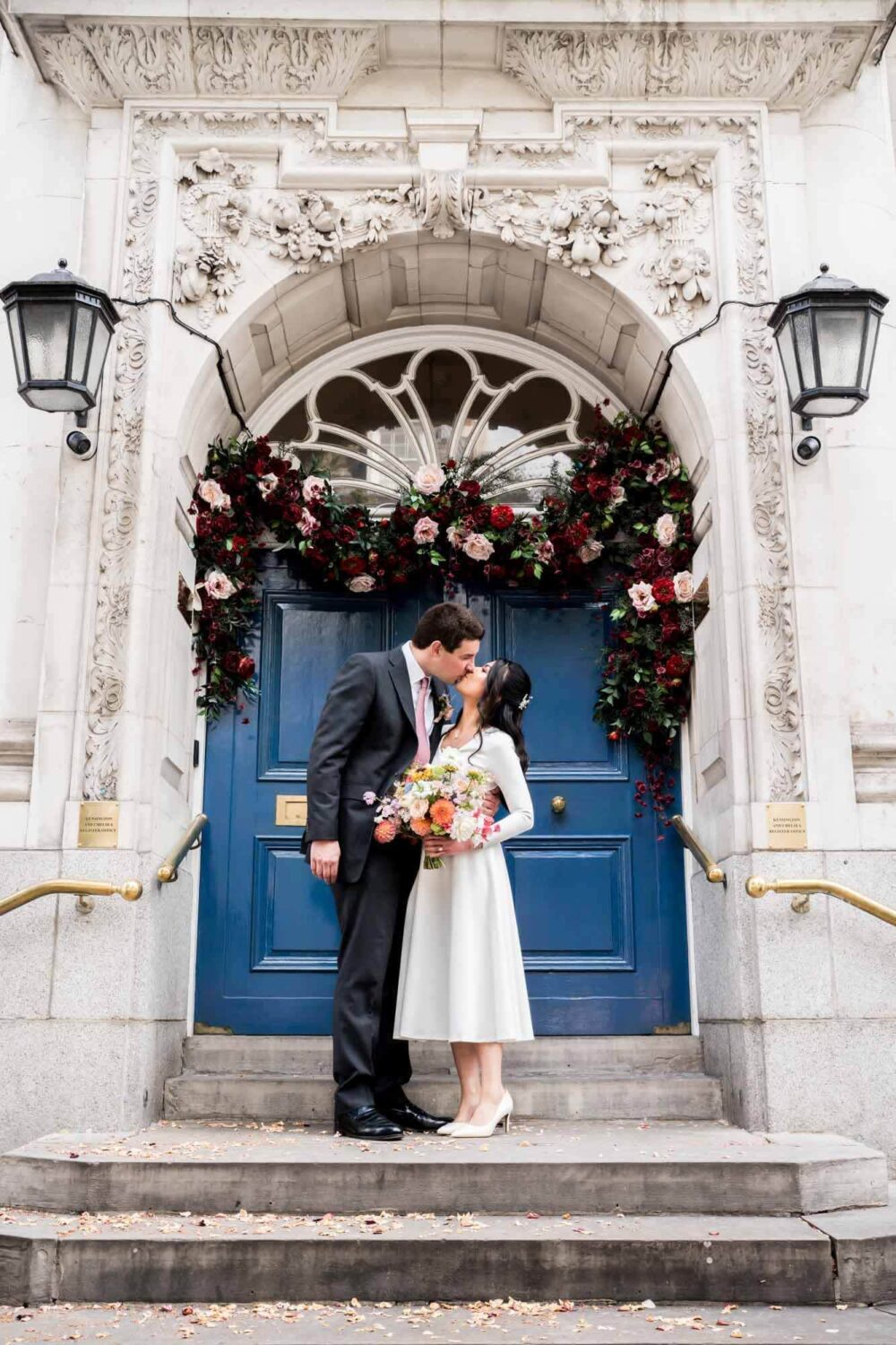 kissing couple on steps of Chelsea old town hall