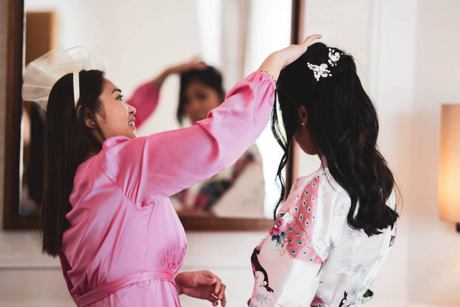 sister in law checking bride's hair