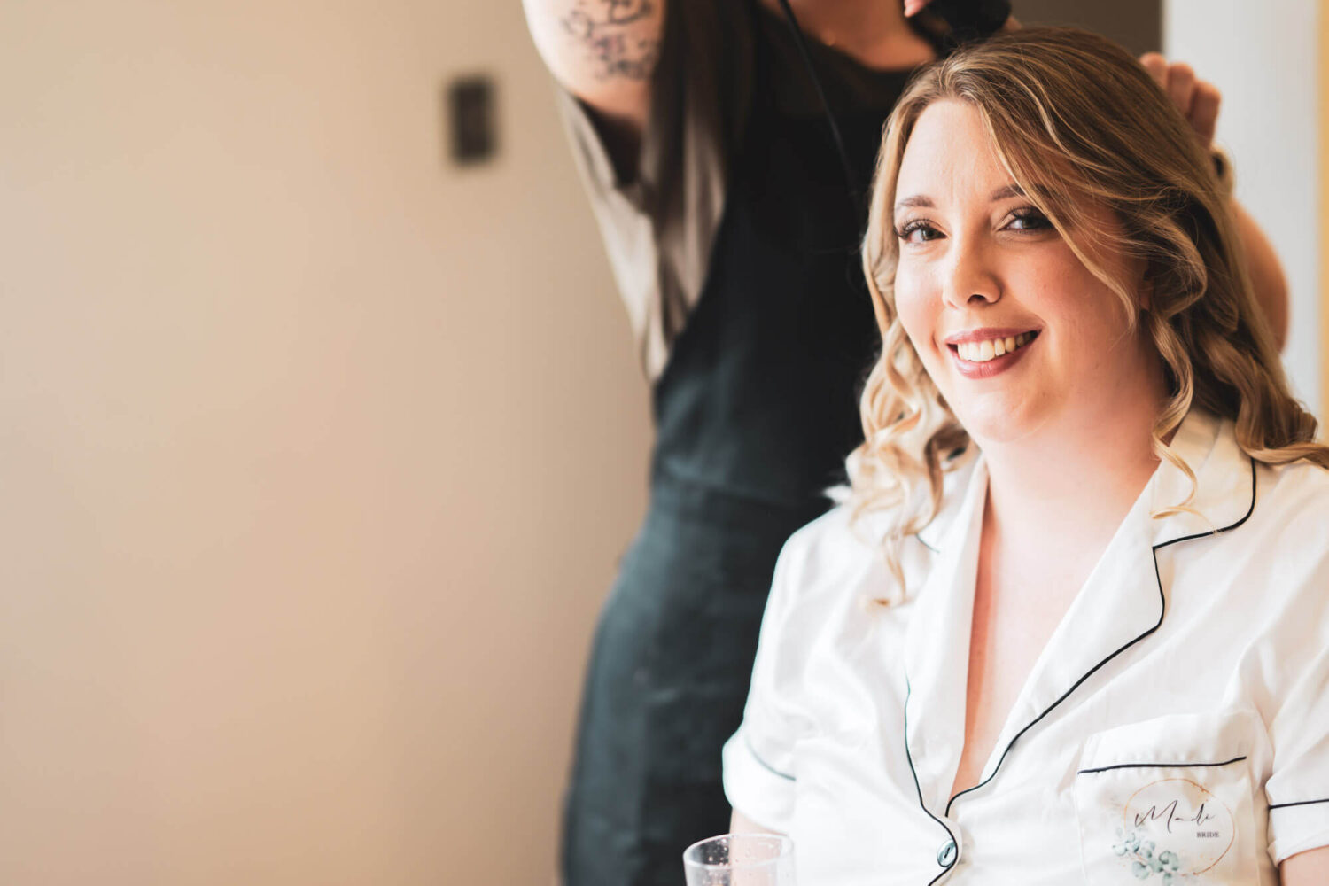 bridal portrait as she gets ready looking into camera