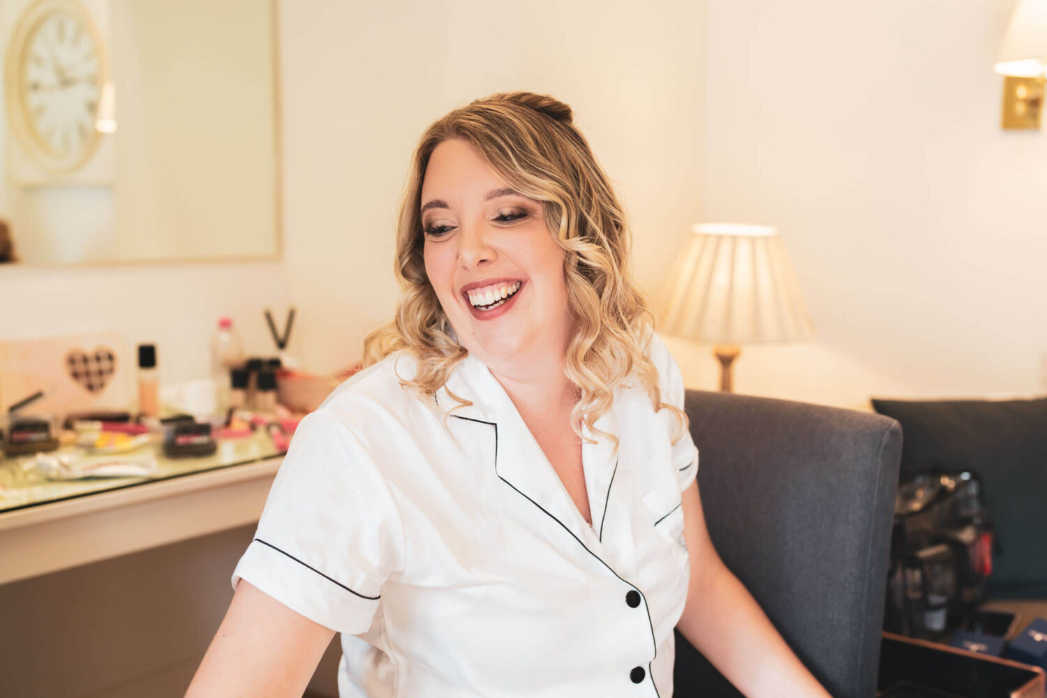 bride laughing in prep room