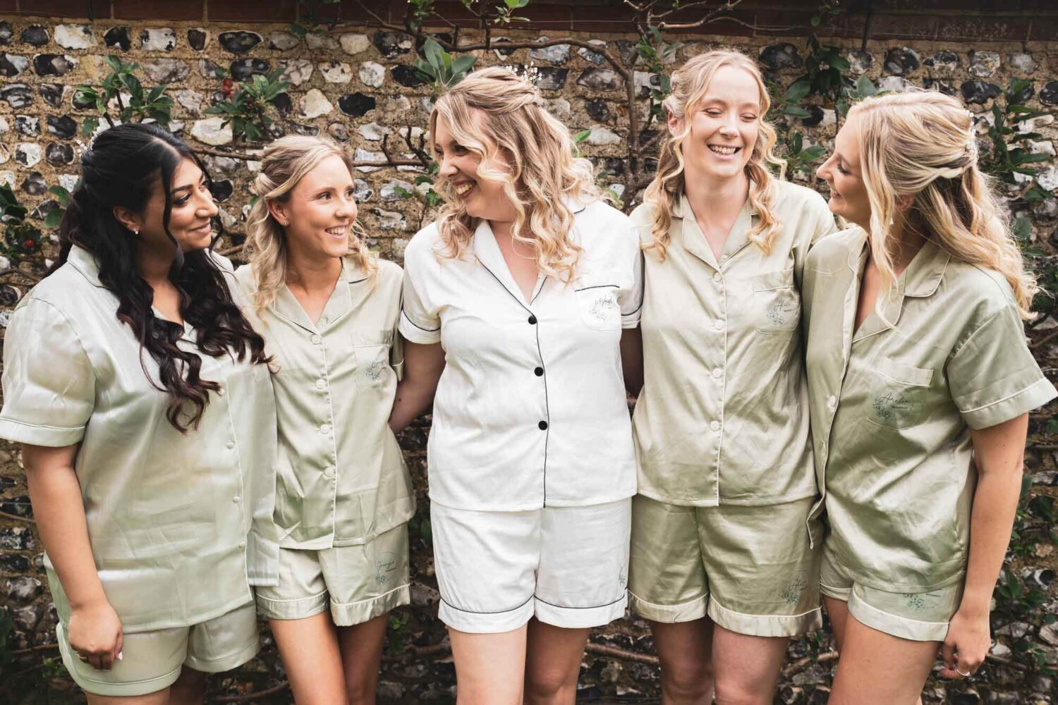 bridesmaids all made up but still in bridal PJs