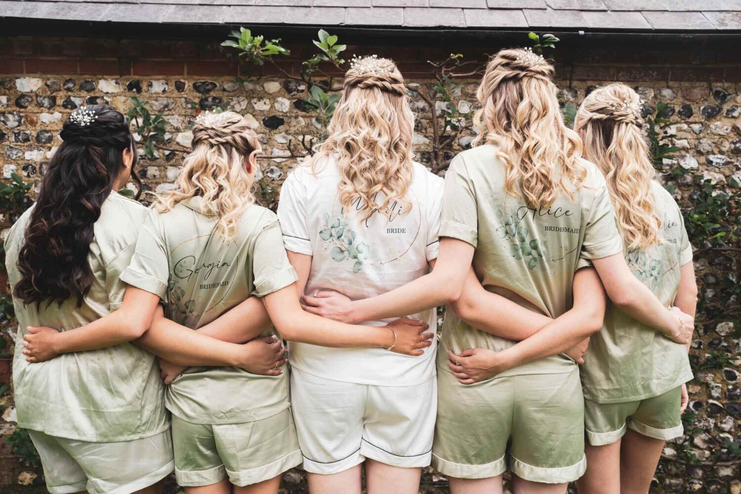 photo of back of bridal party in their PJs
