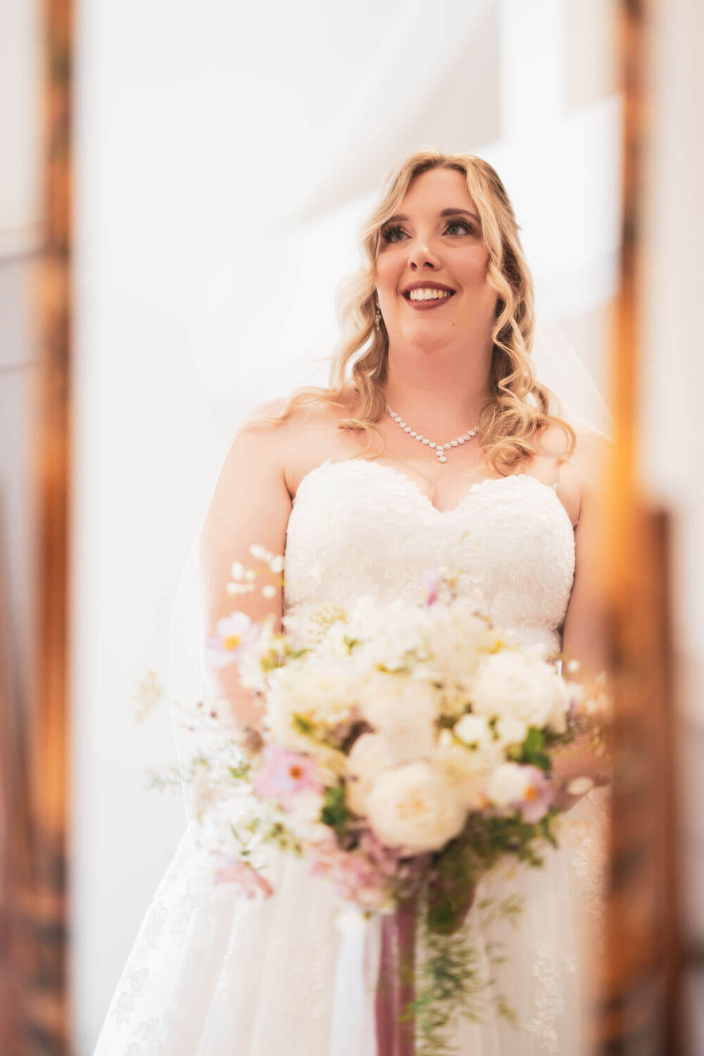 bride reflection in mirror smiling
