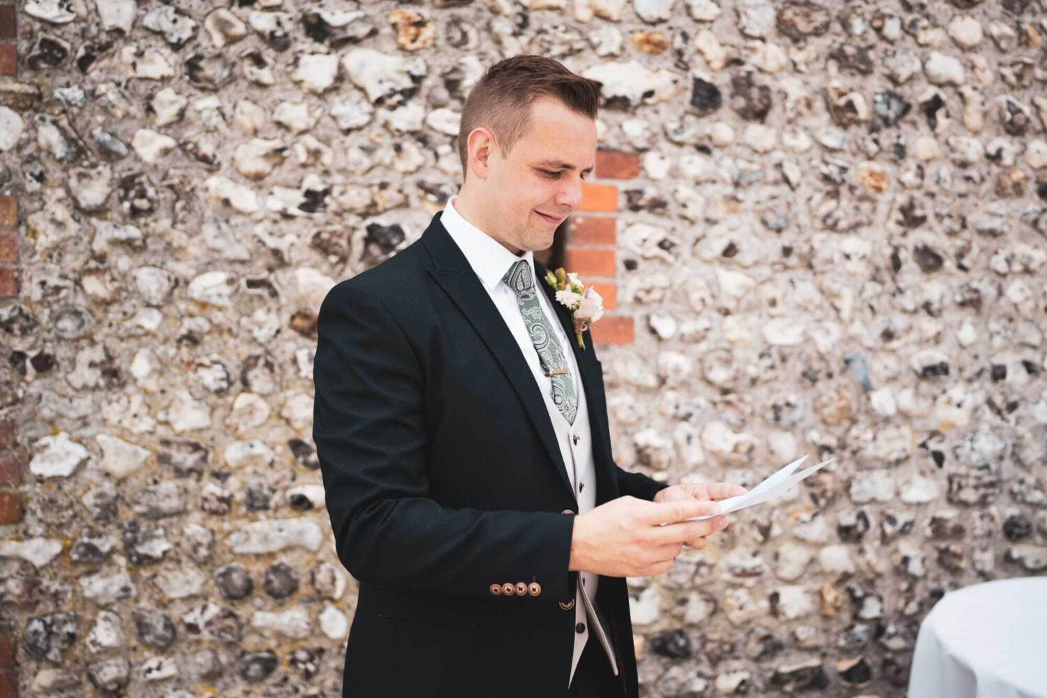 groom reading letter from his bride