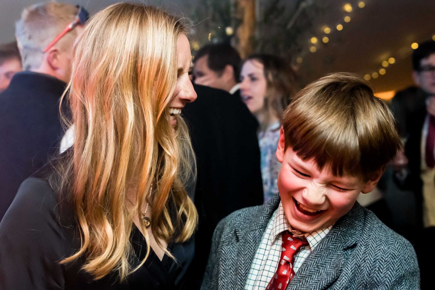 mother and son sharing a laugh on the dance floor