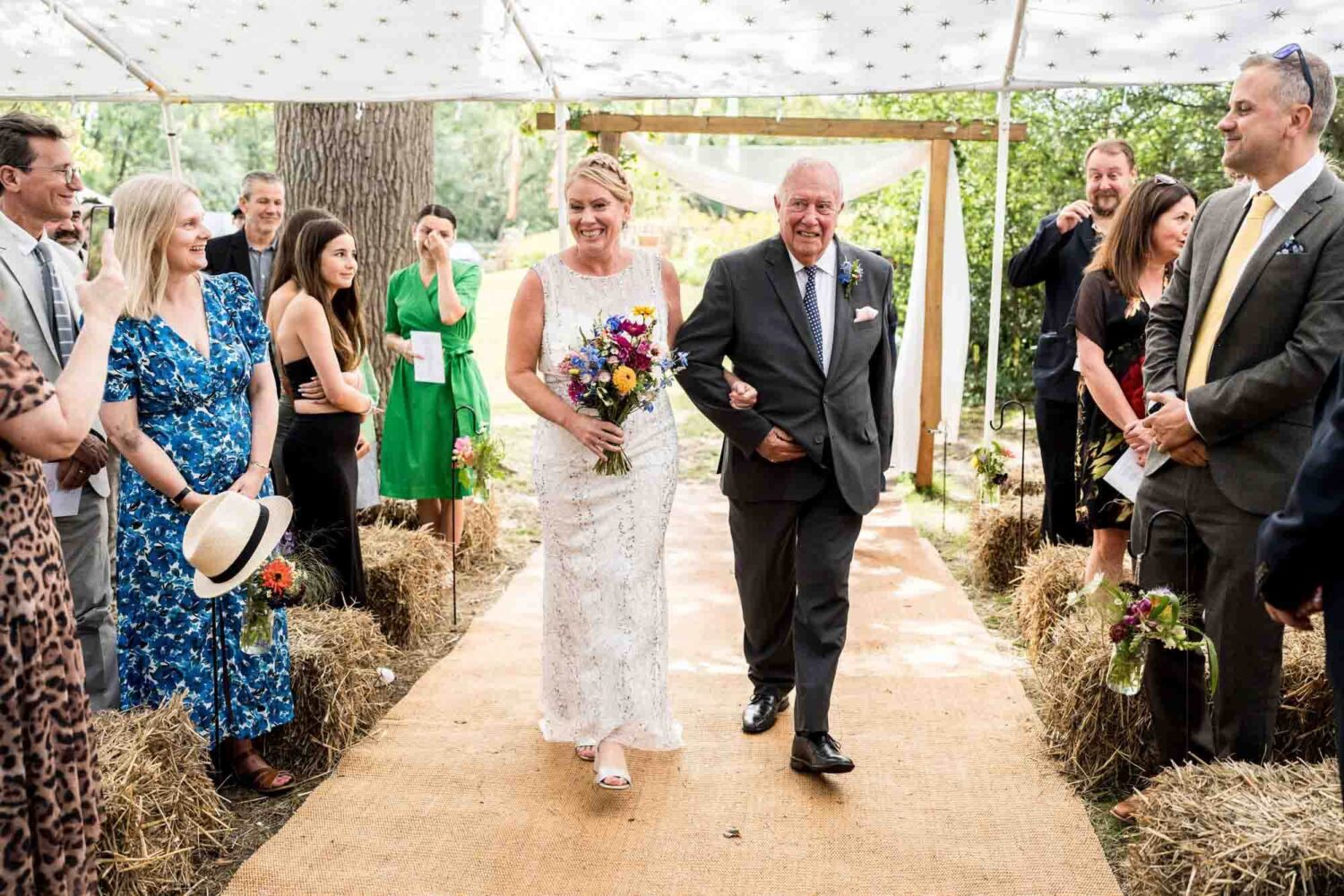 bride and groom walking up aisle