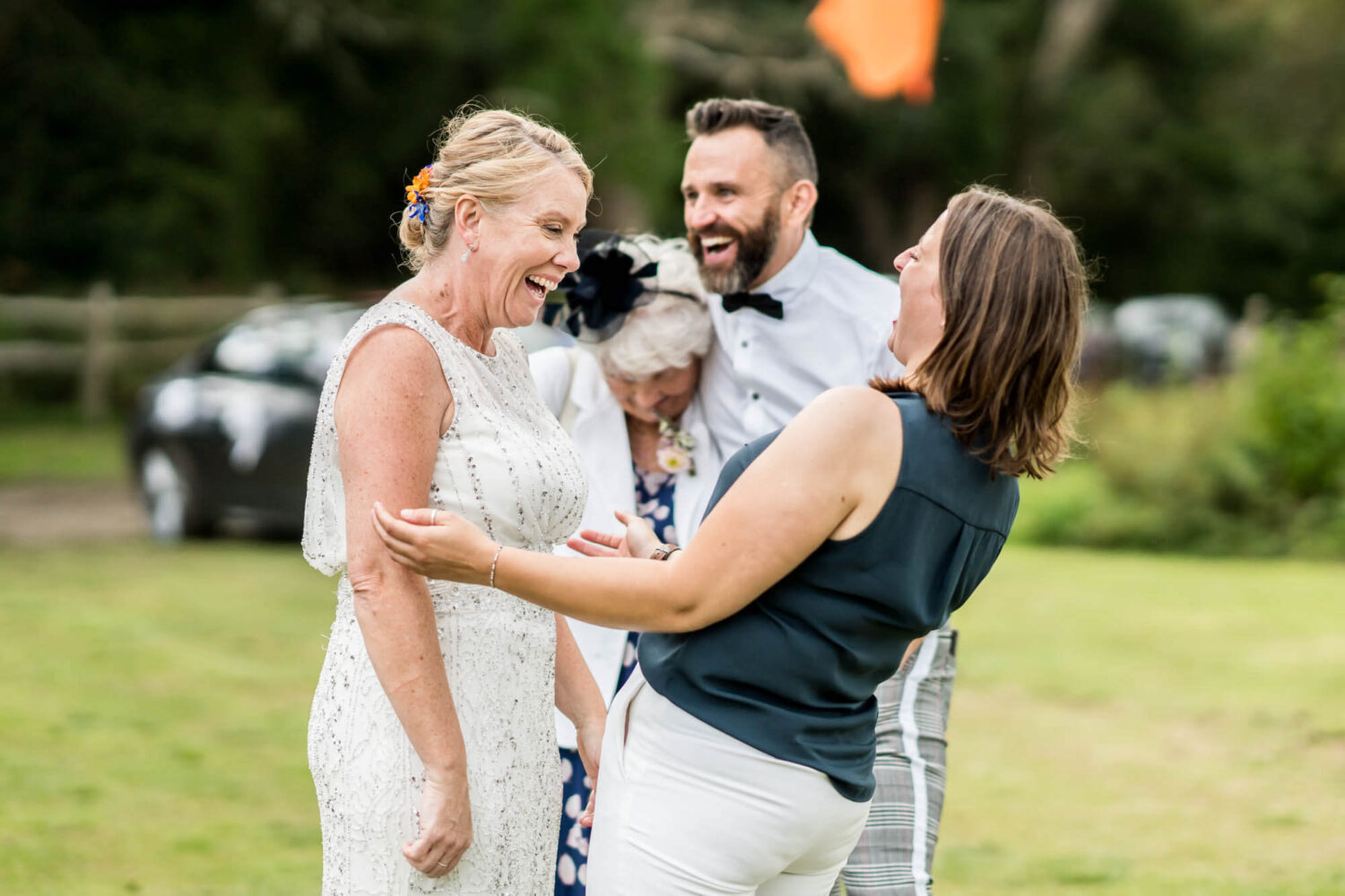 bride laughing with a guest