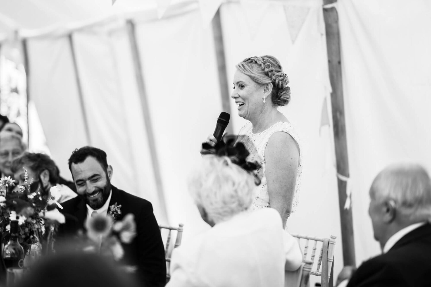 bride holding microphone doing a speech