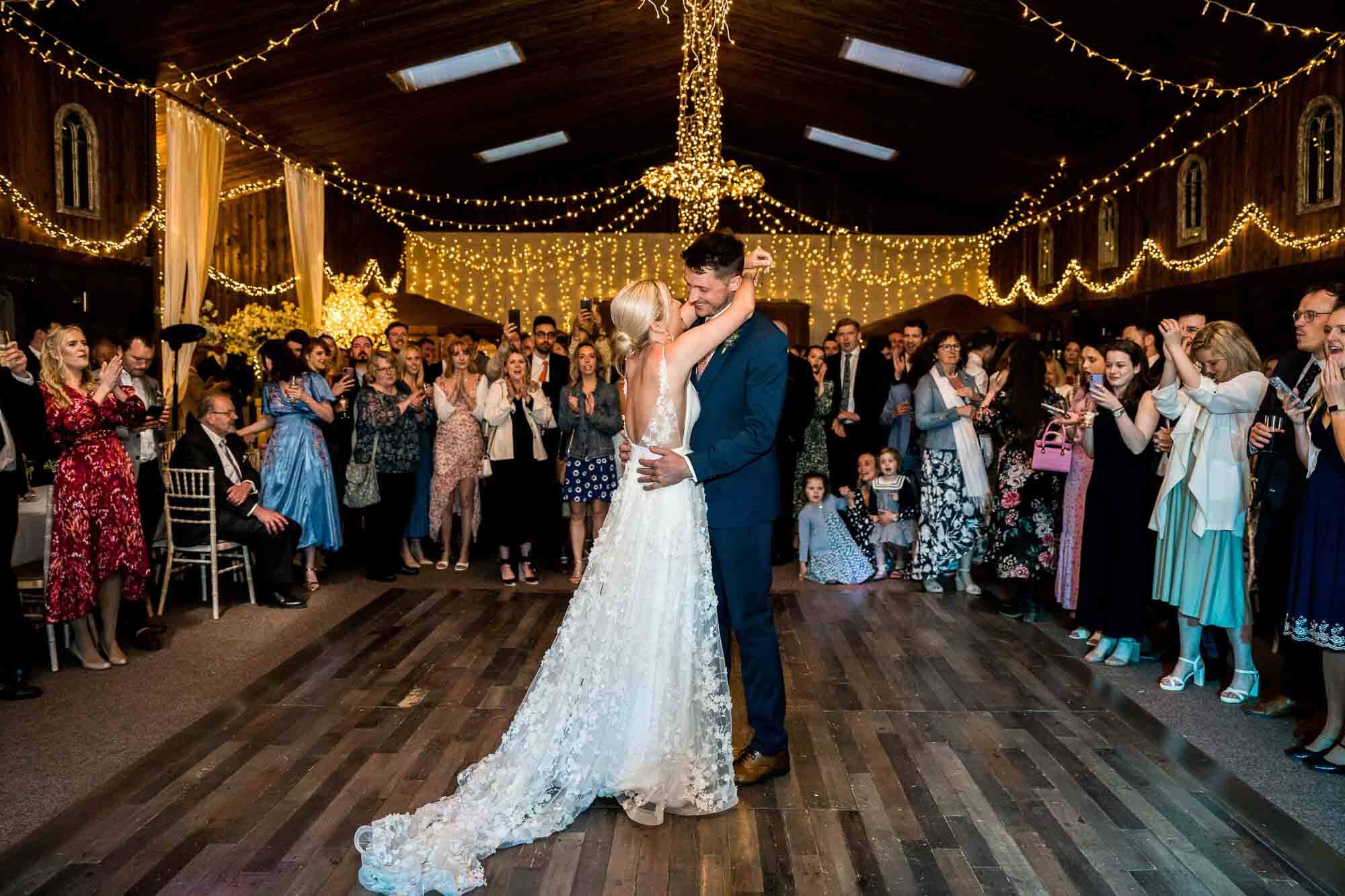 bride and groom doing first dance hugging each other
