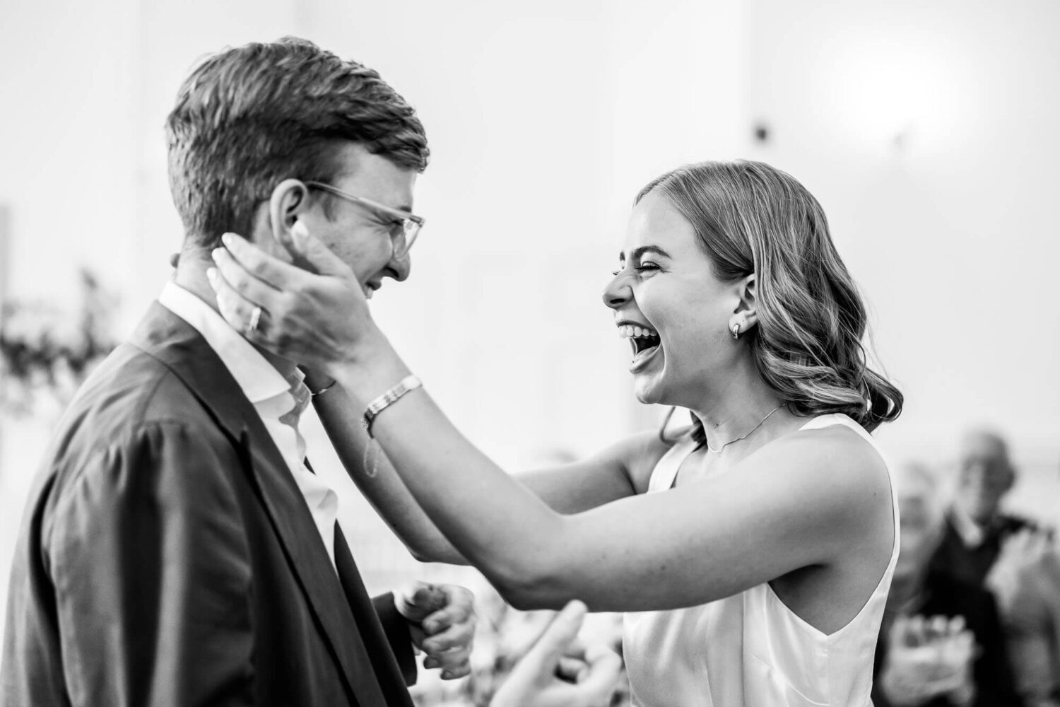 bride cups her her husbands face