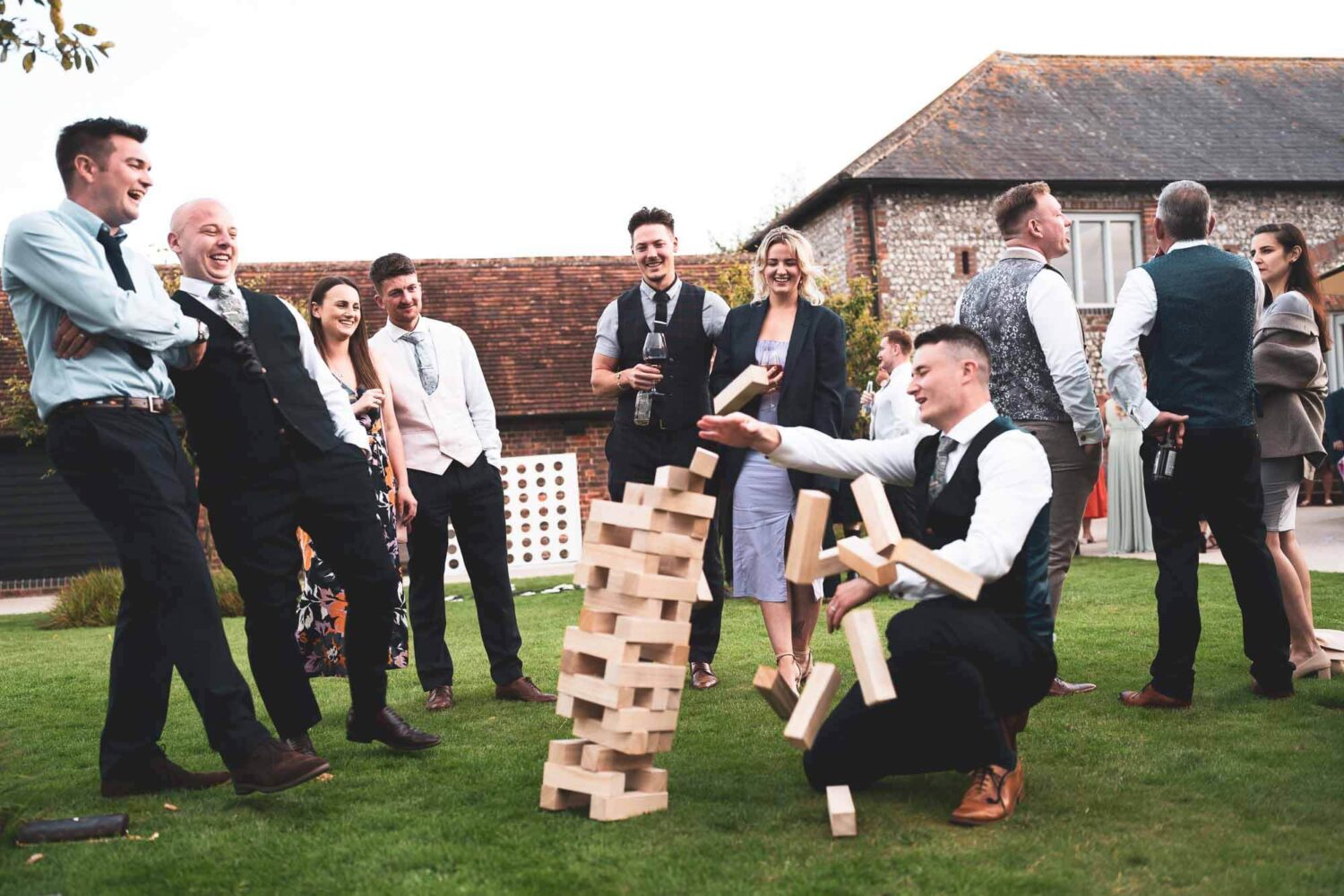 party playing jenga and bricks falling