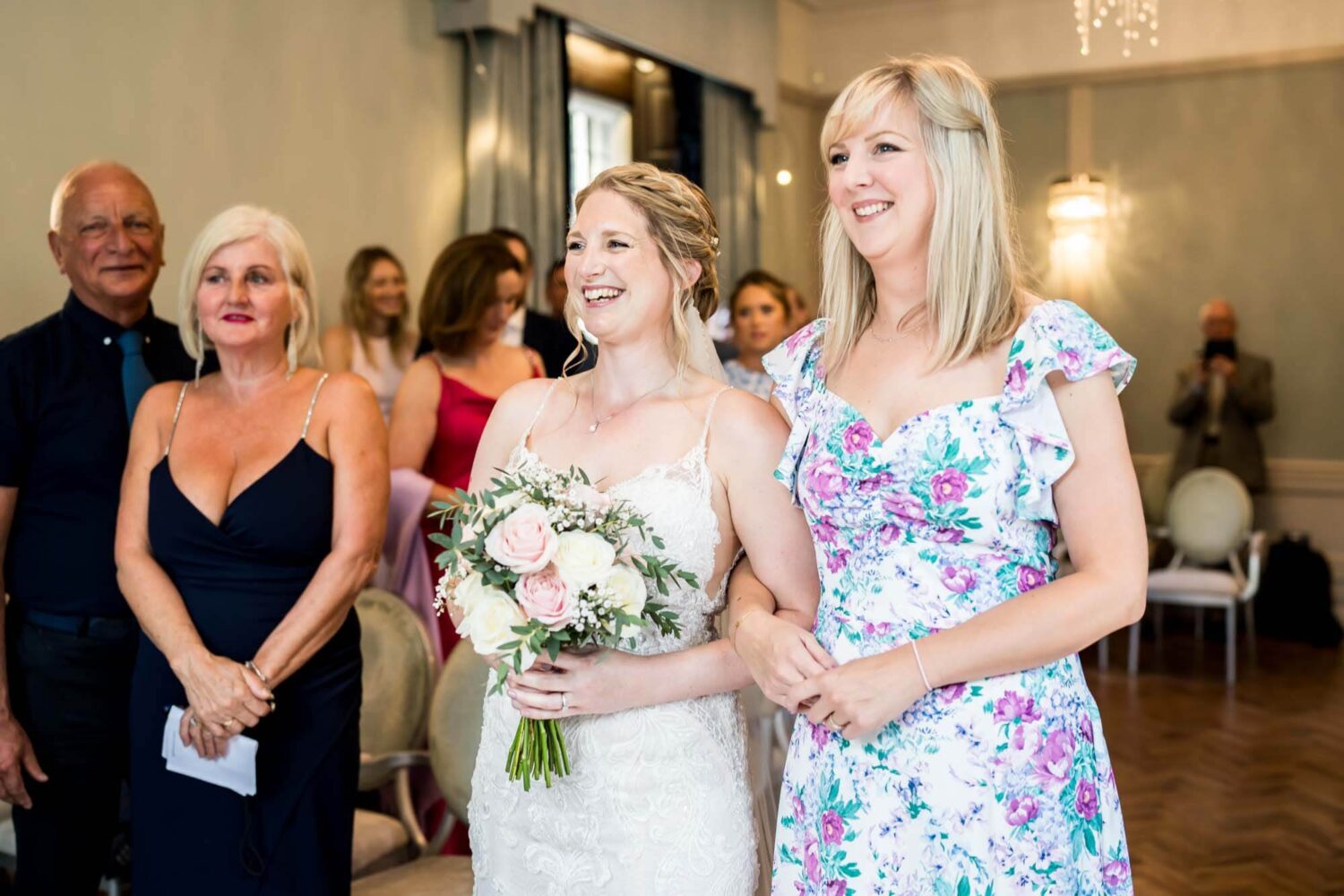 bridal walking down aisle with her sister