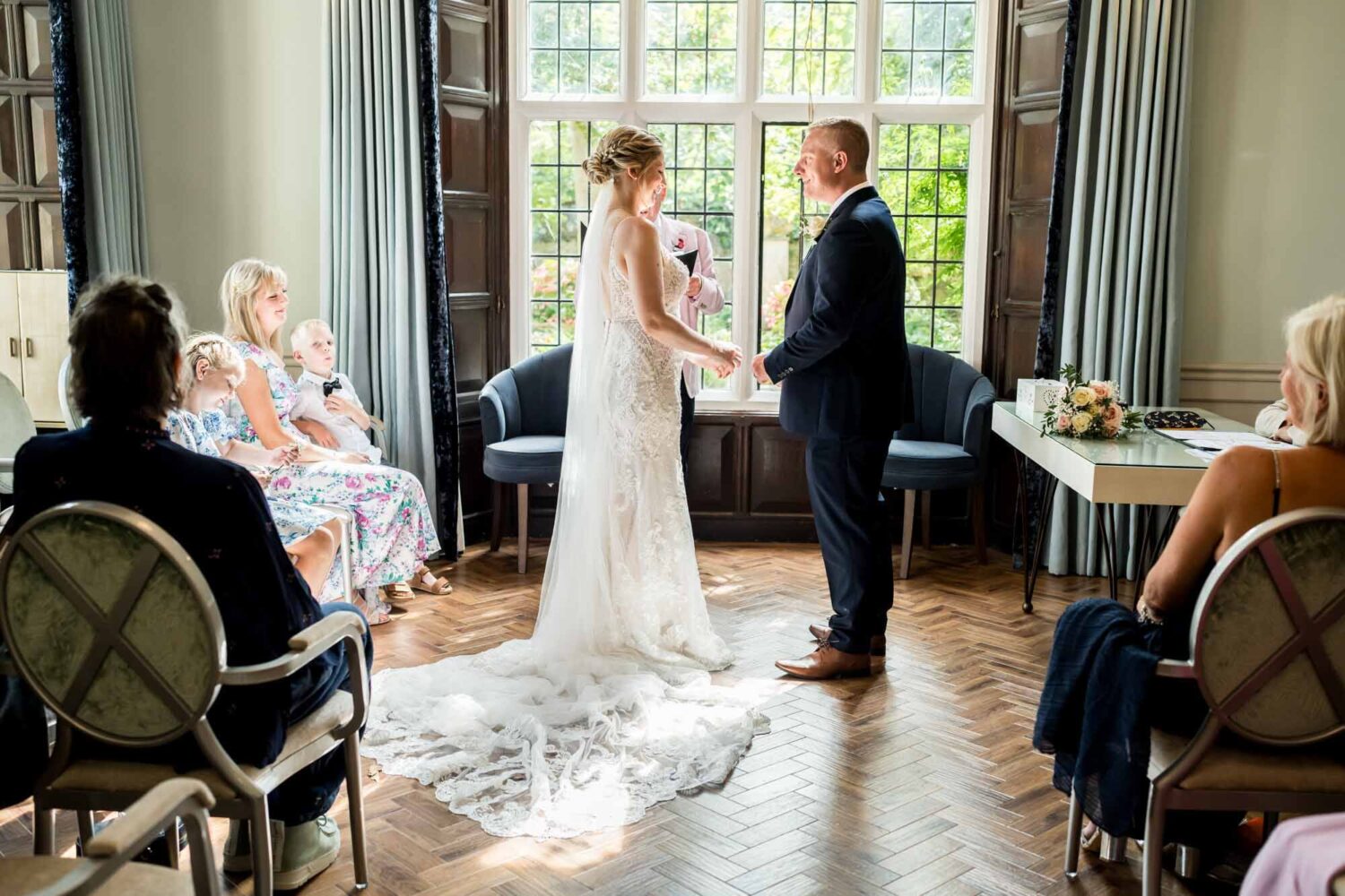 bride and groom standing together in ceremony room