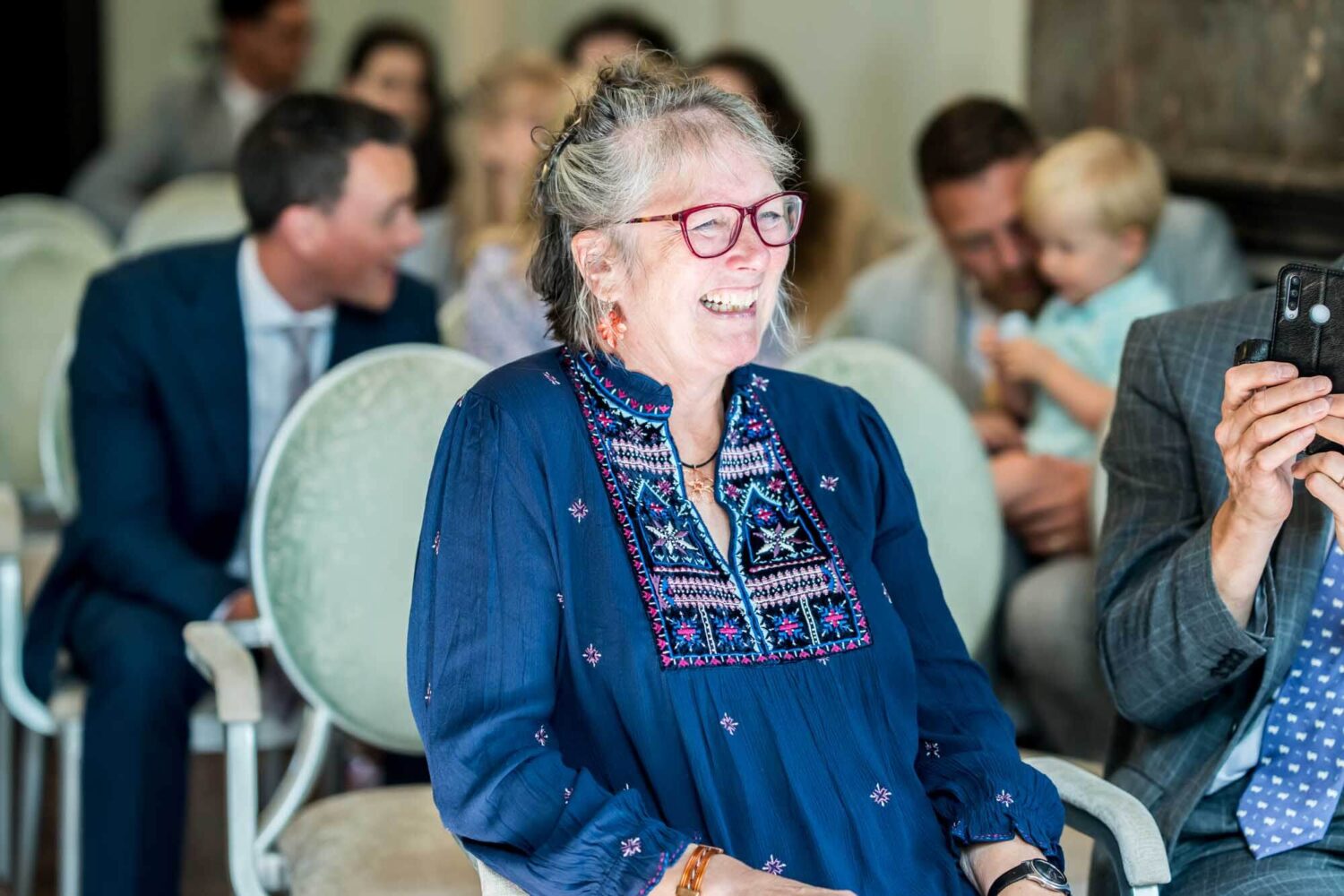 mother of the bride smiling during ceremony