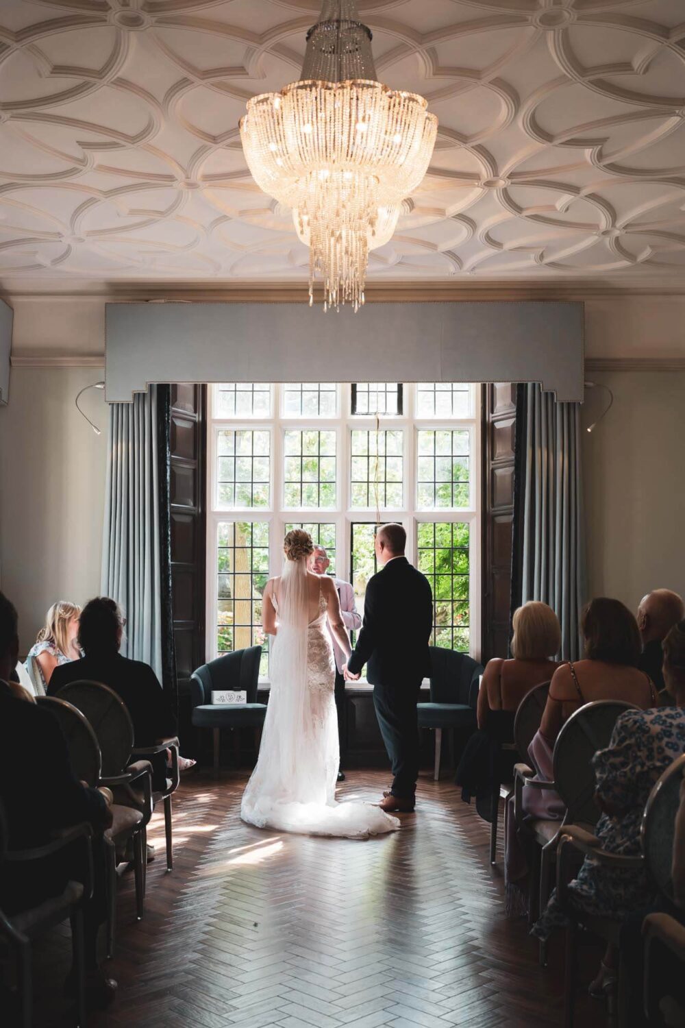 shot from behind of bride and groom