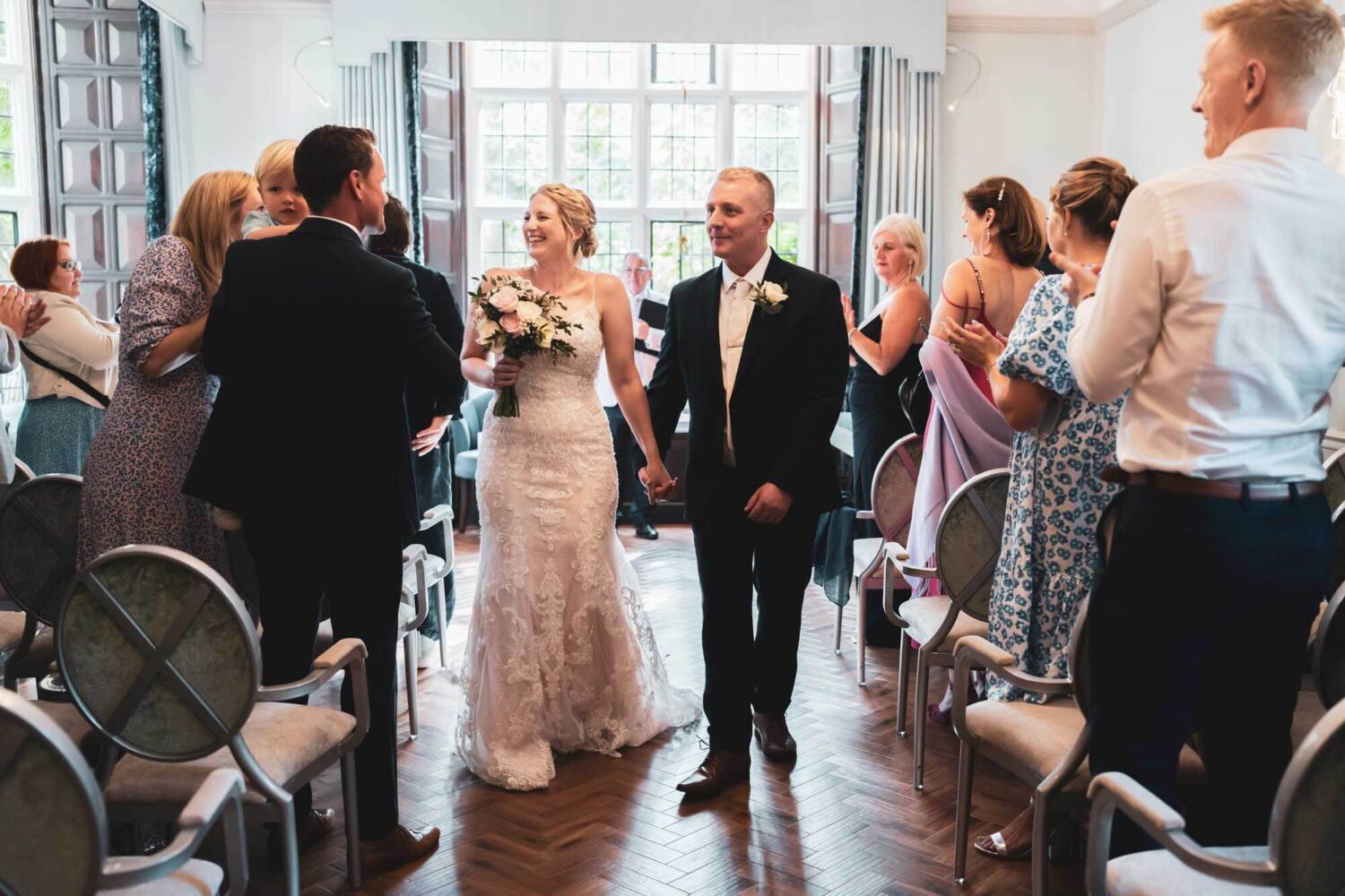 bride and groom walking back down the aisle