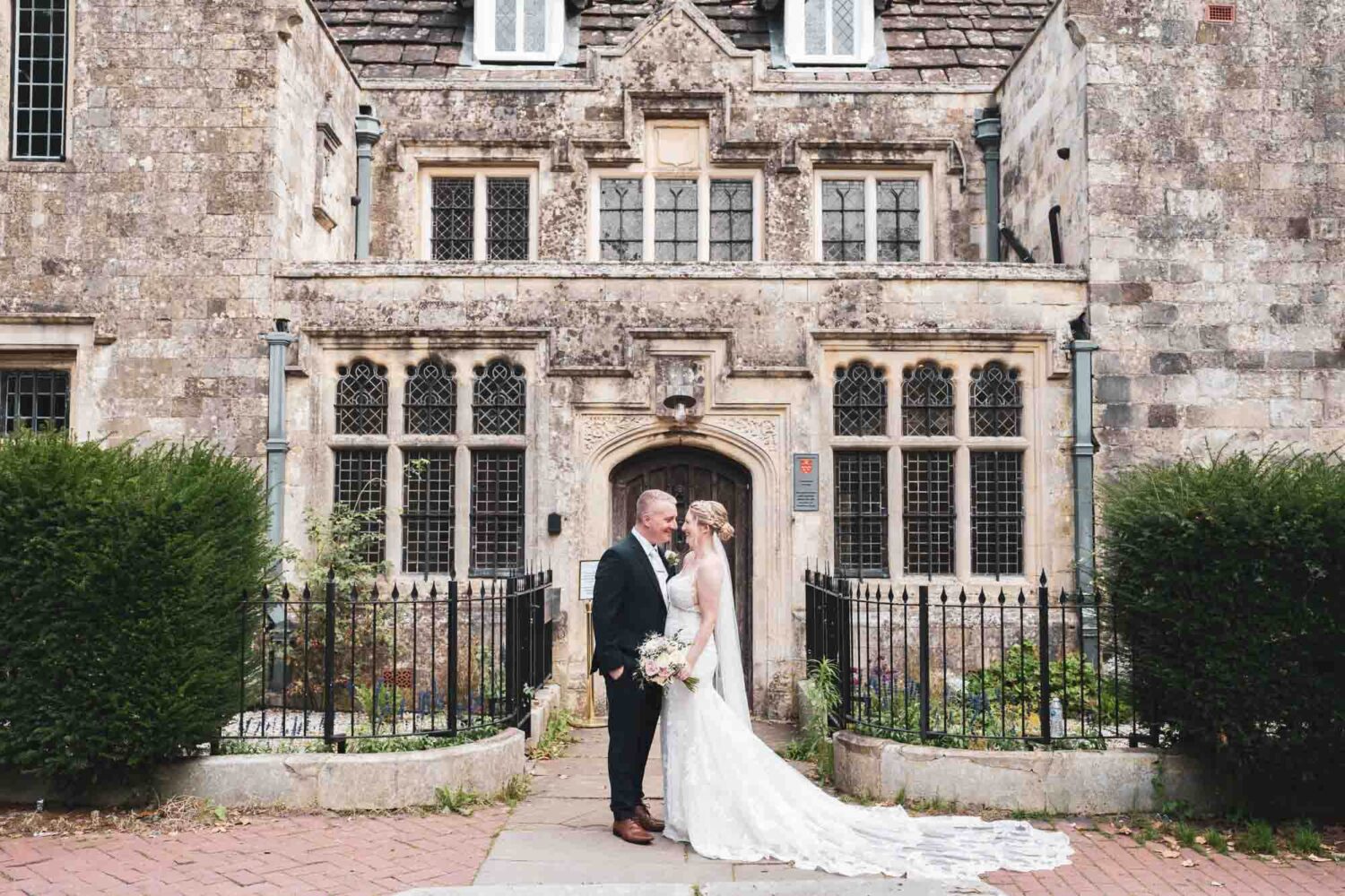 bride and groom standing outside Southover grange registry office