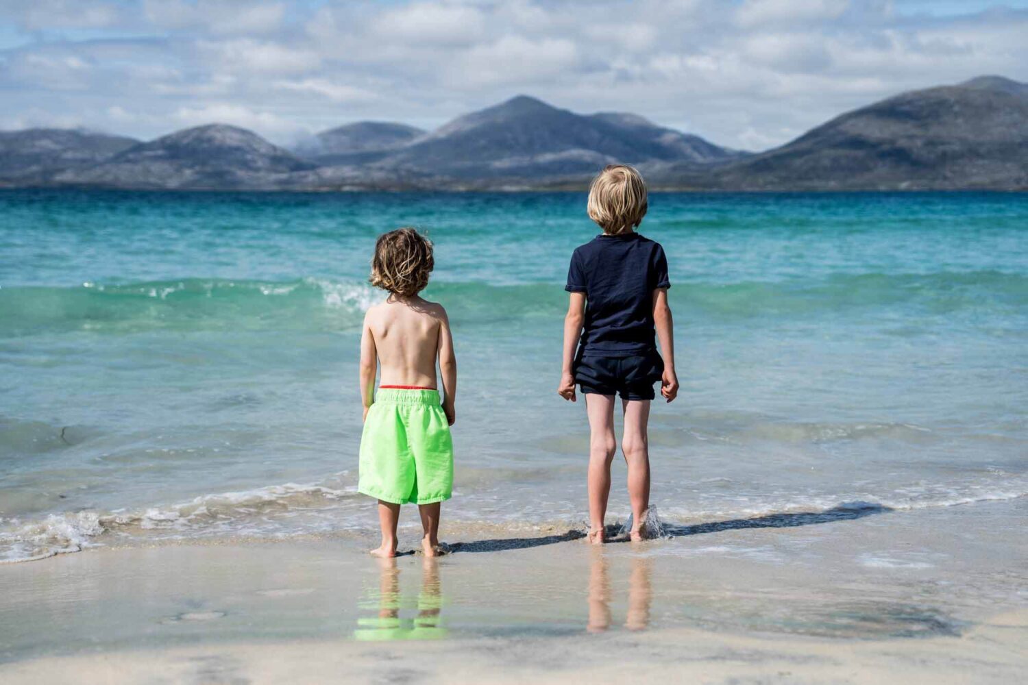 boys standing on the shores of Luskentyre beach isle of harris