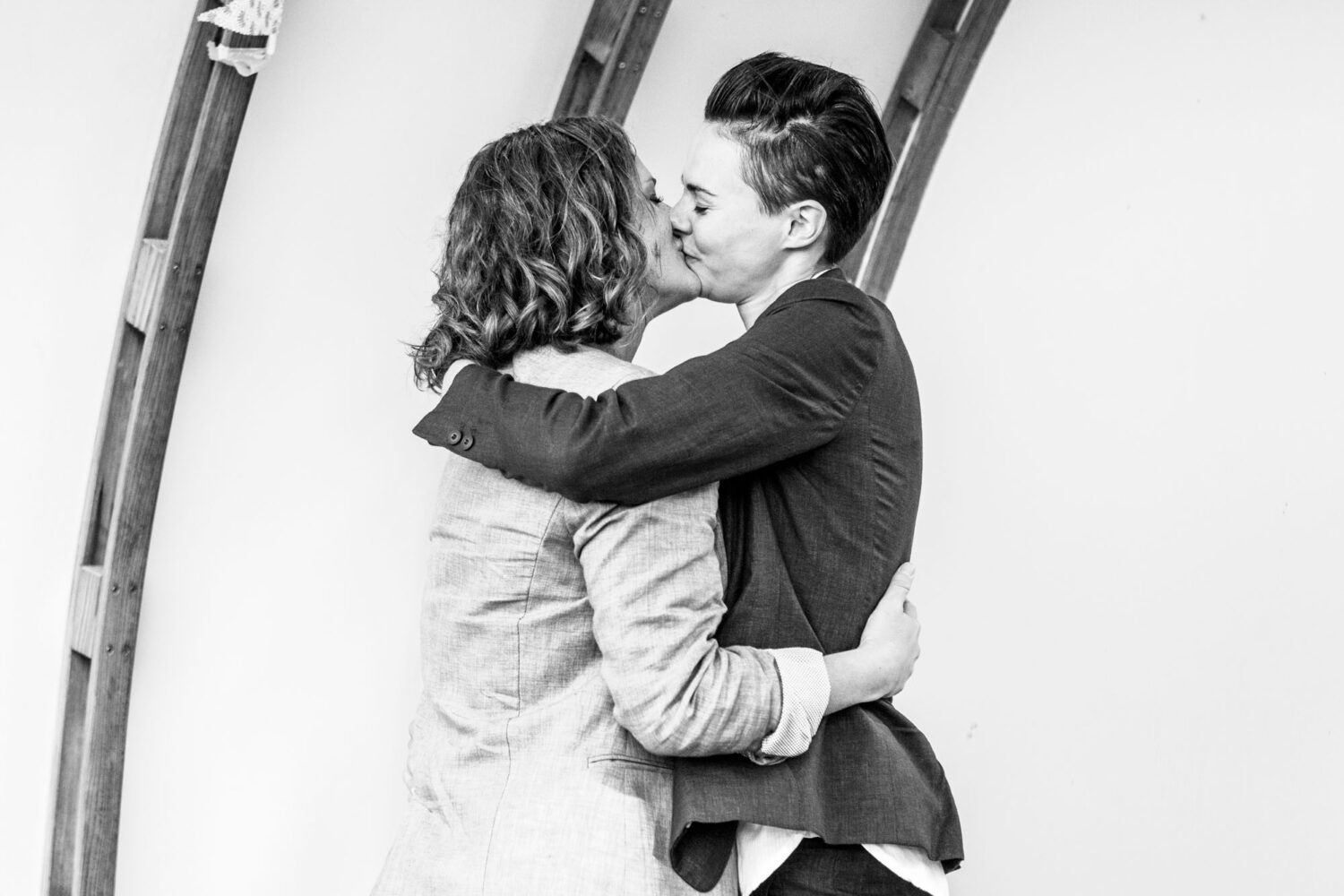 two women kissing having just got married