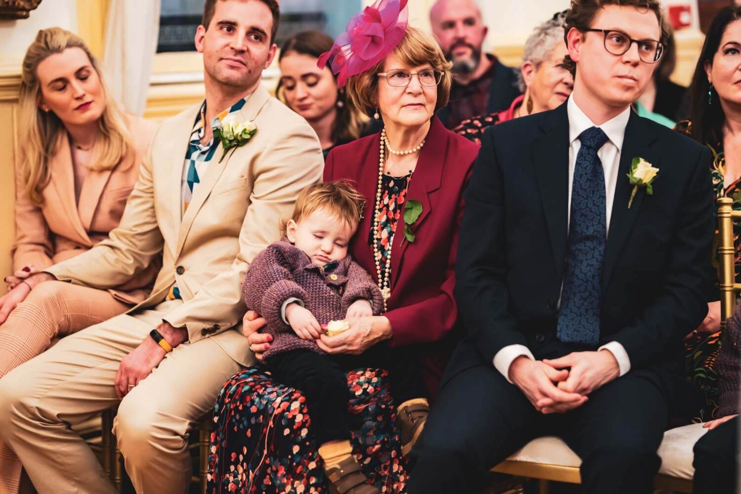 baby asleep in grandmothers arms