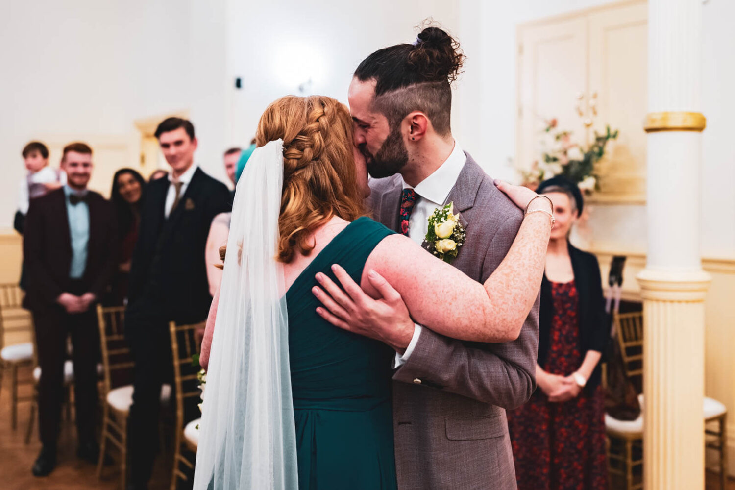 groom kisses bride