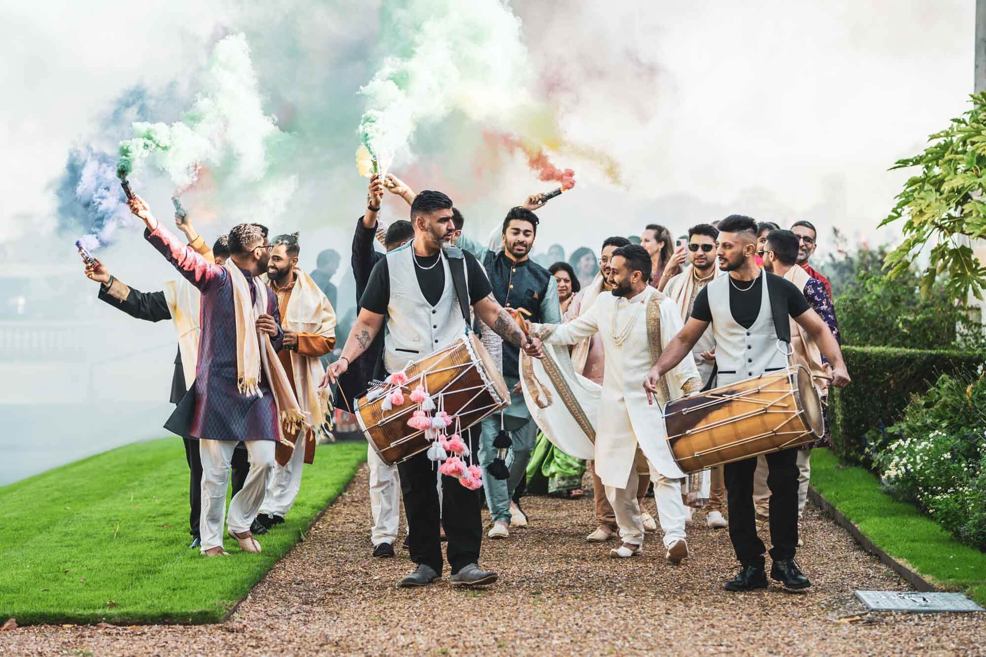 baraat procession with drums and smoke bombs at firle place
