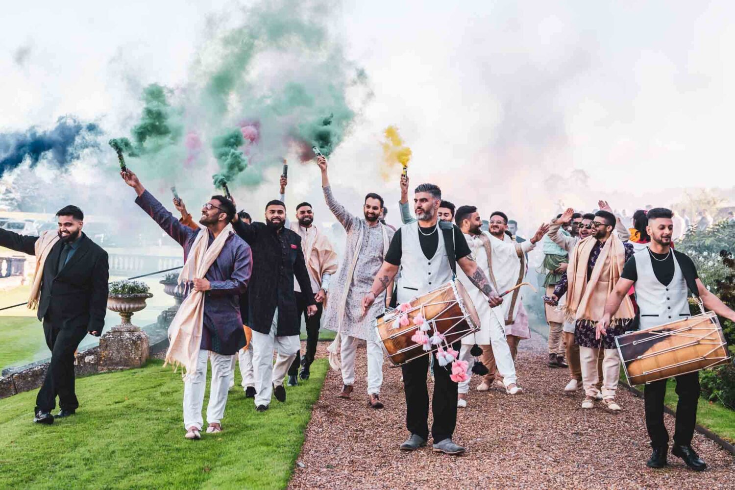 baraat procession with drums and smoke bombs at firle place