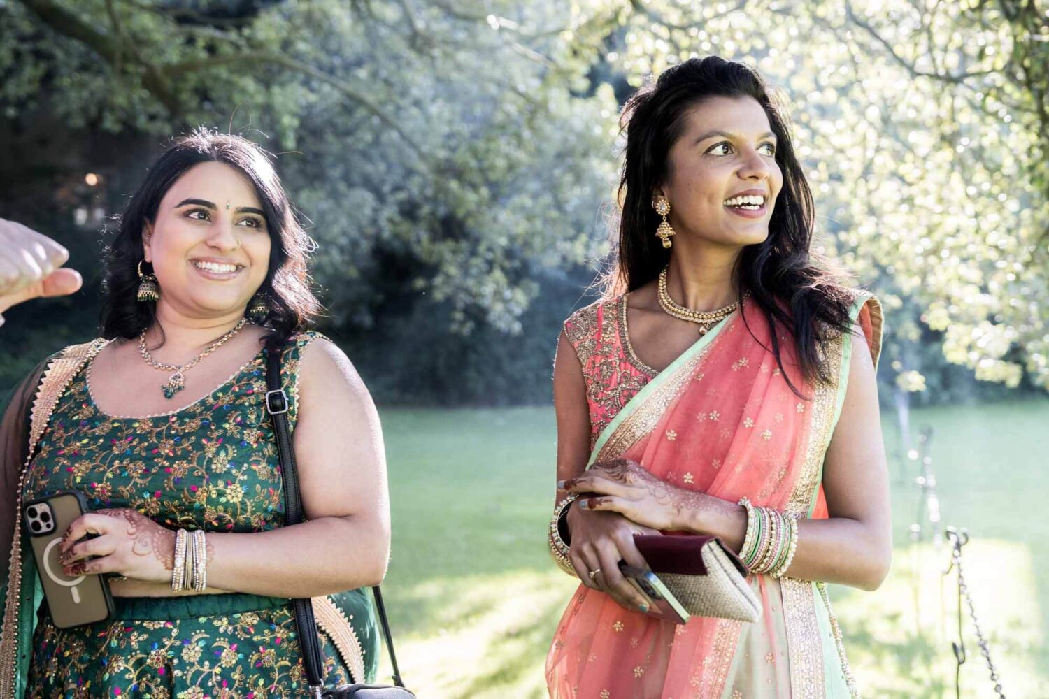 two guests smiling away from the camera at firle place