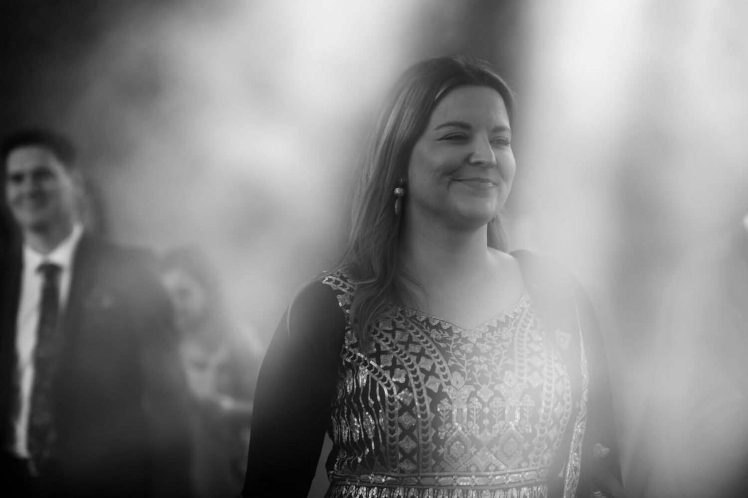 guests amid smoke from smoke bomb during baraat ceremony at firle place