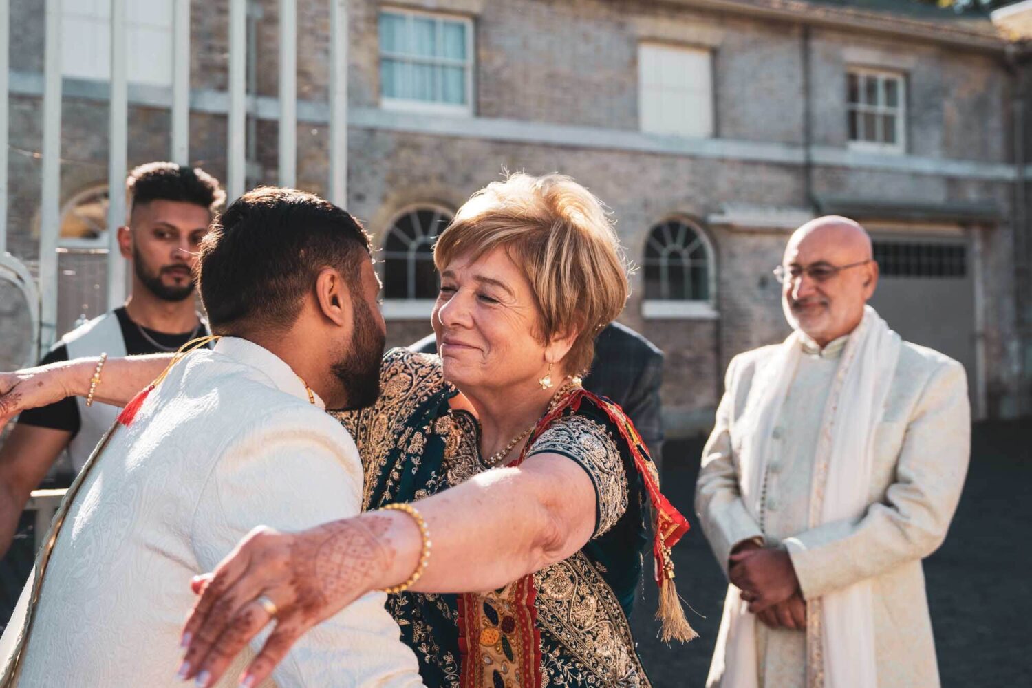 mother going to hug new brother in law at firle place