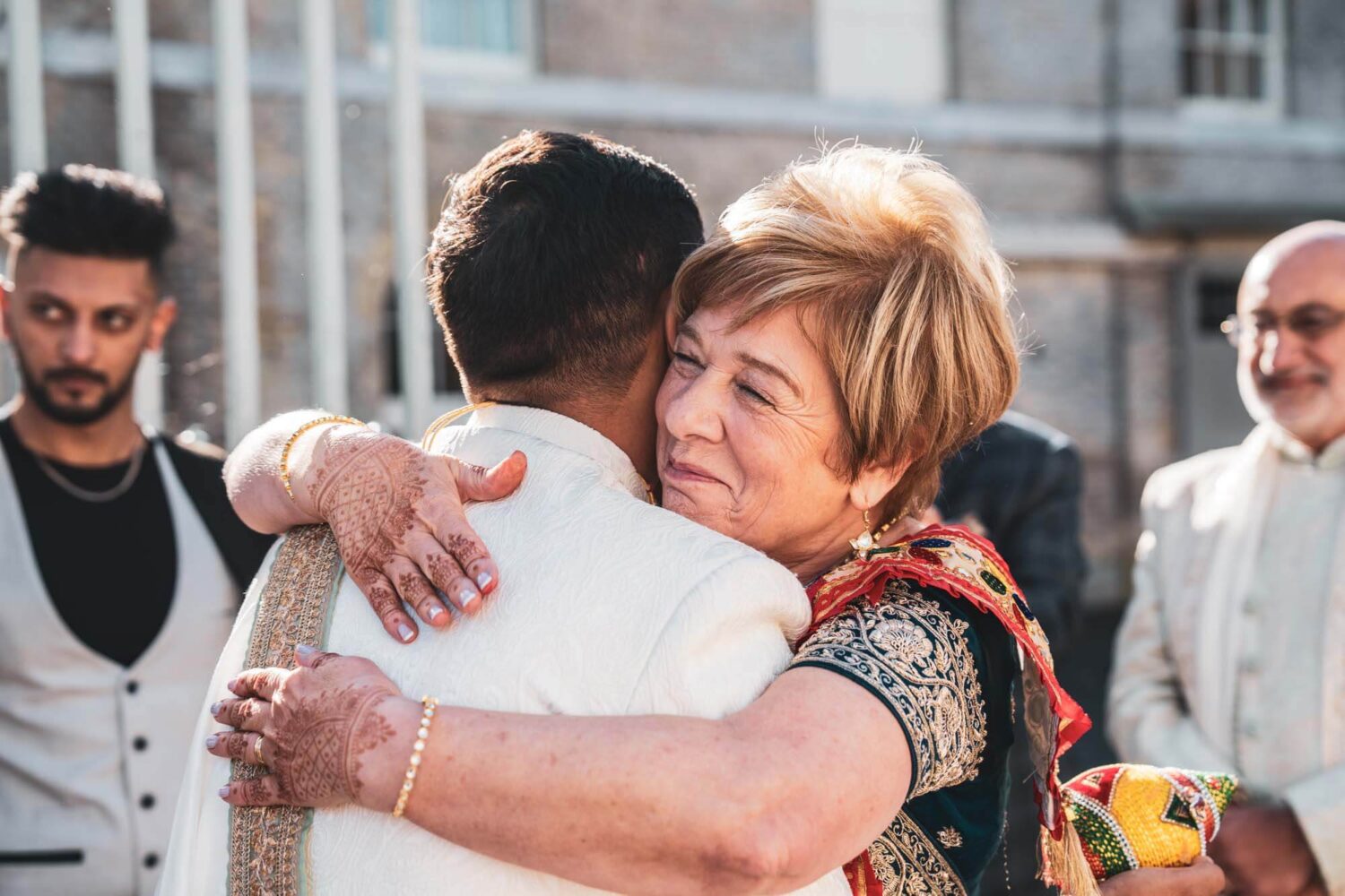 mother going to hug new brother in law at firle place