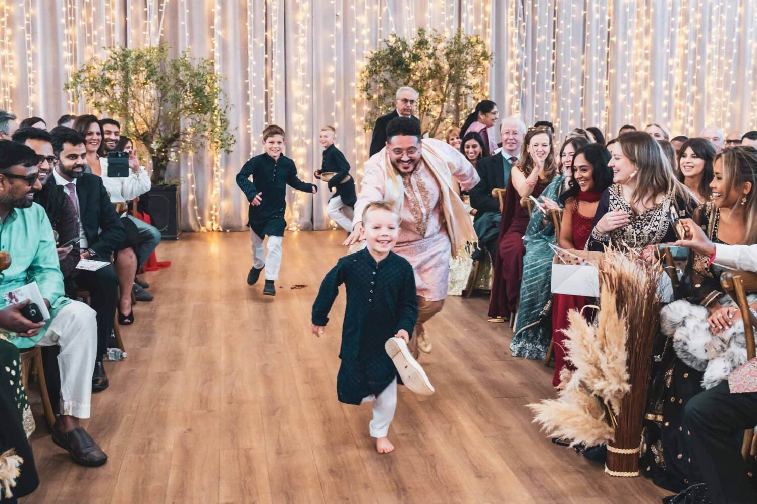 kid being chased for stolen shoe at hindu ceremony in firle place
