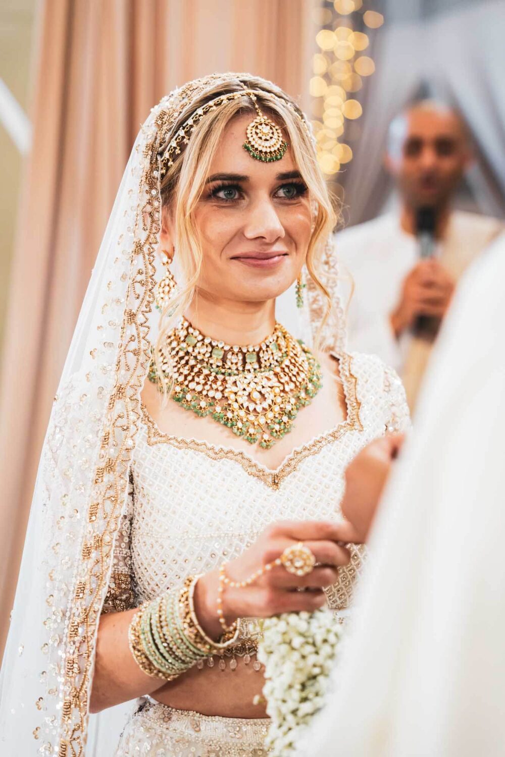 bride looking towards husband on mandap at firle place