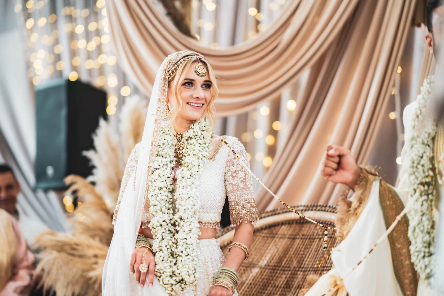 bride smiling at mandap at firle place
