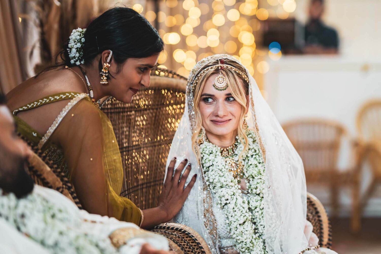 friend touching bride's shoulder during hindu ceremony at firle place