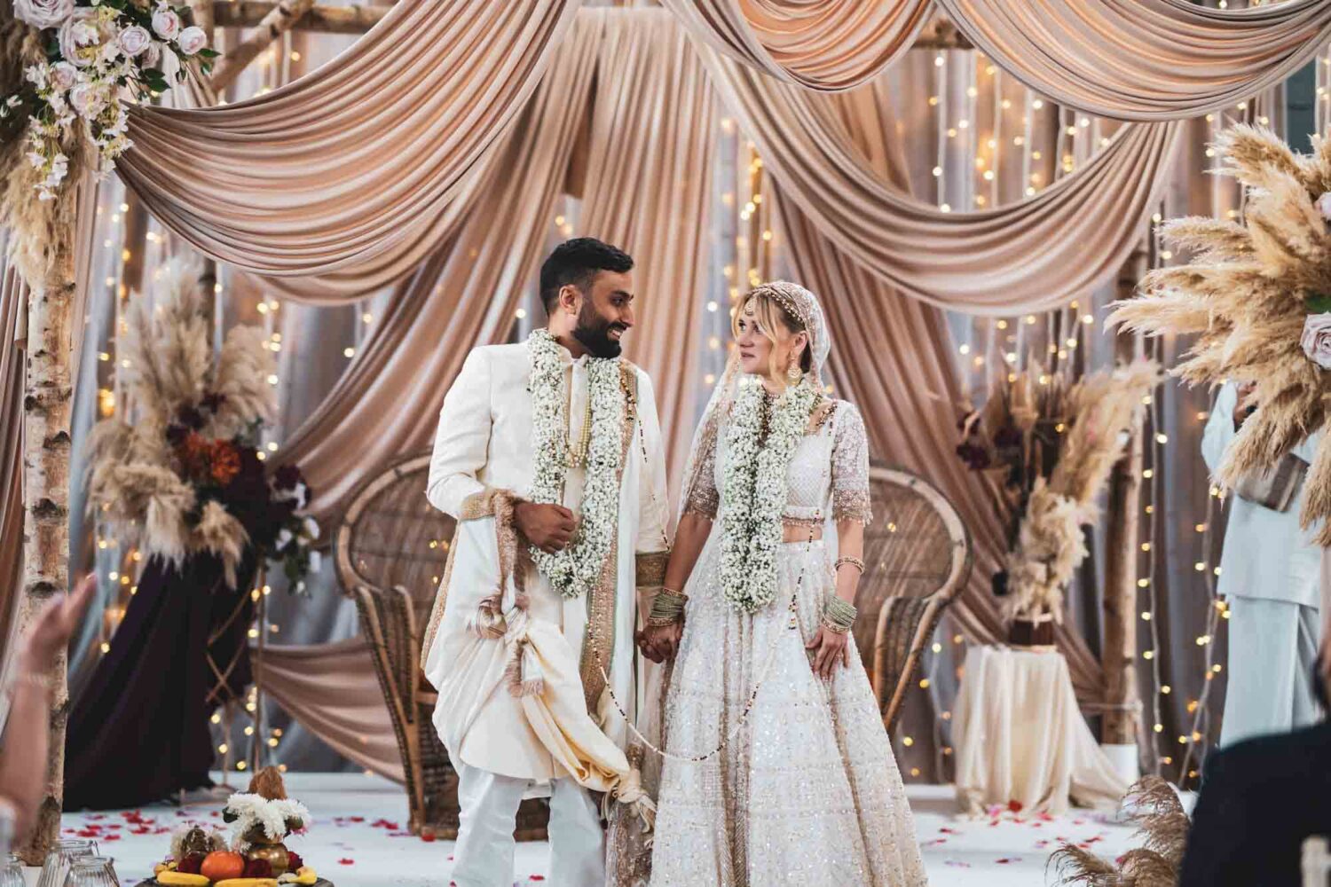 bride and groom on mandap at firle place celebrating getting married