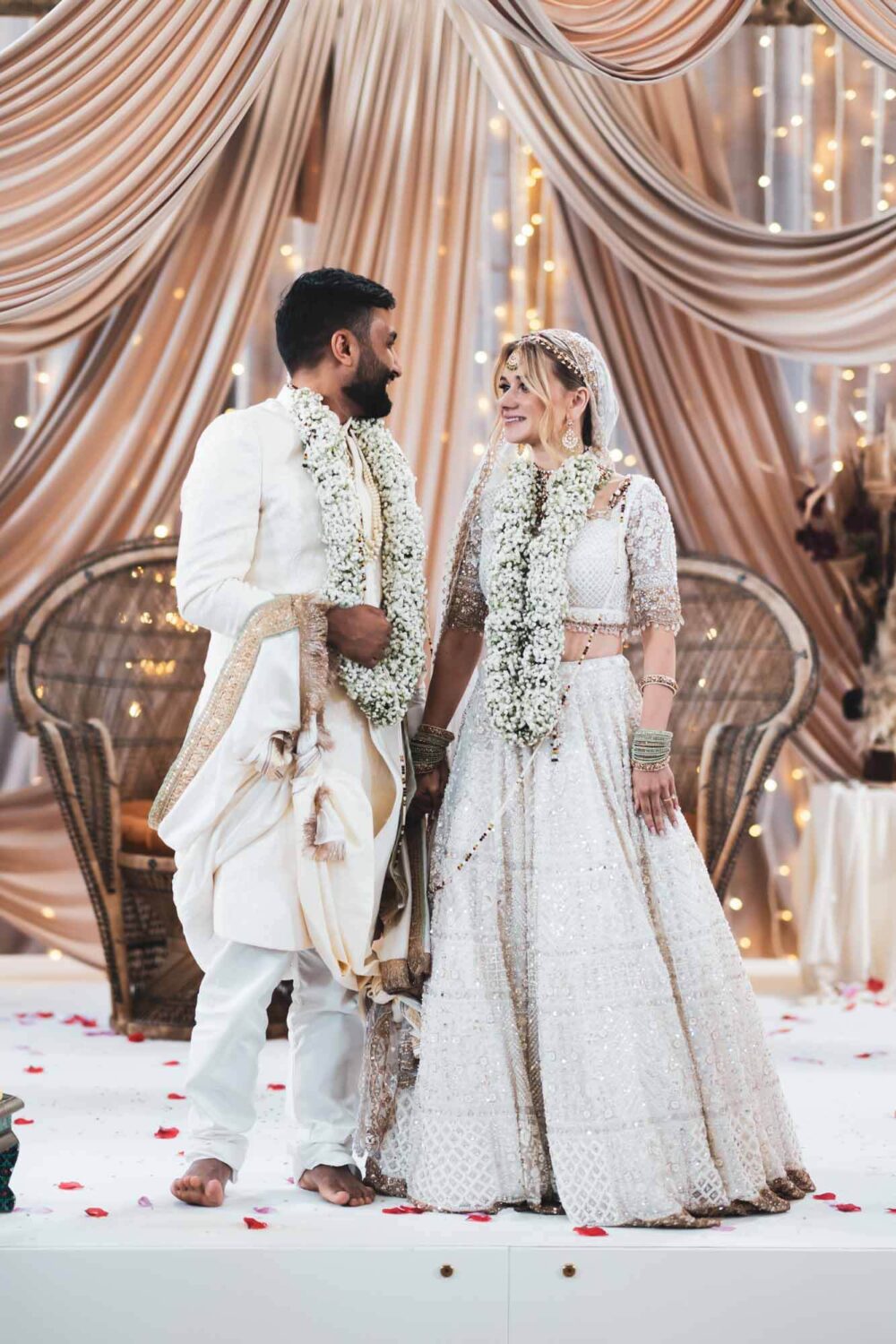bride and groom on mandap at firle place celebrating getting married