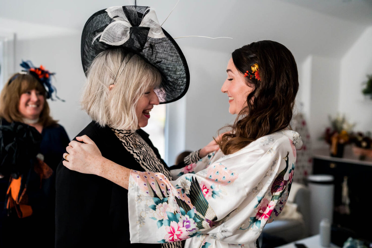 mother and daughter hug in dressing room at highley manor