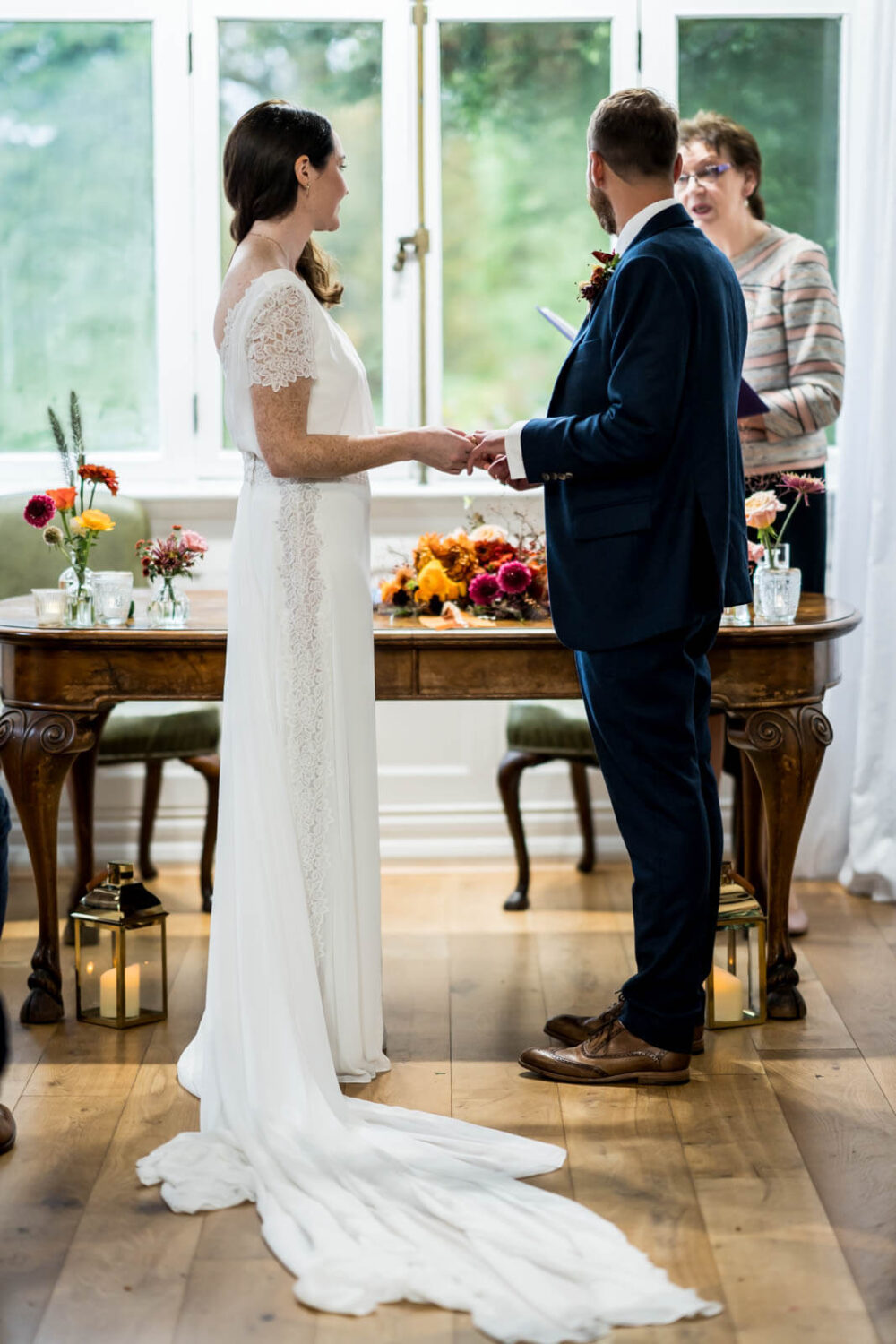 bride and groom holding hands at highley manor