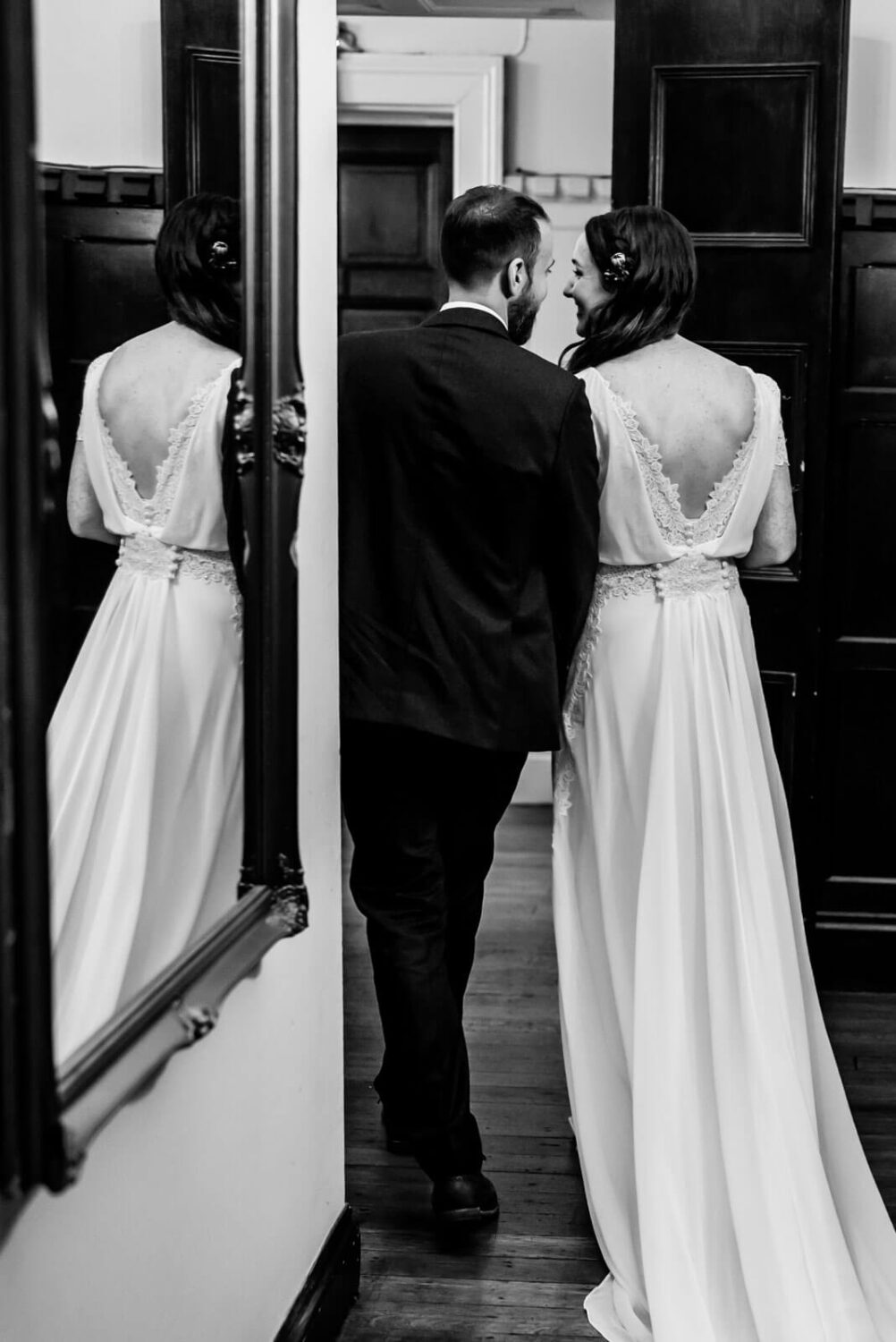 bride and groom walking away shot from behind at highley manor