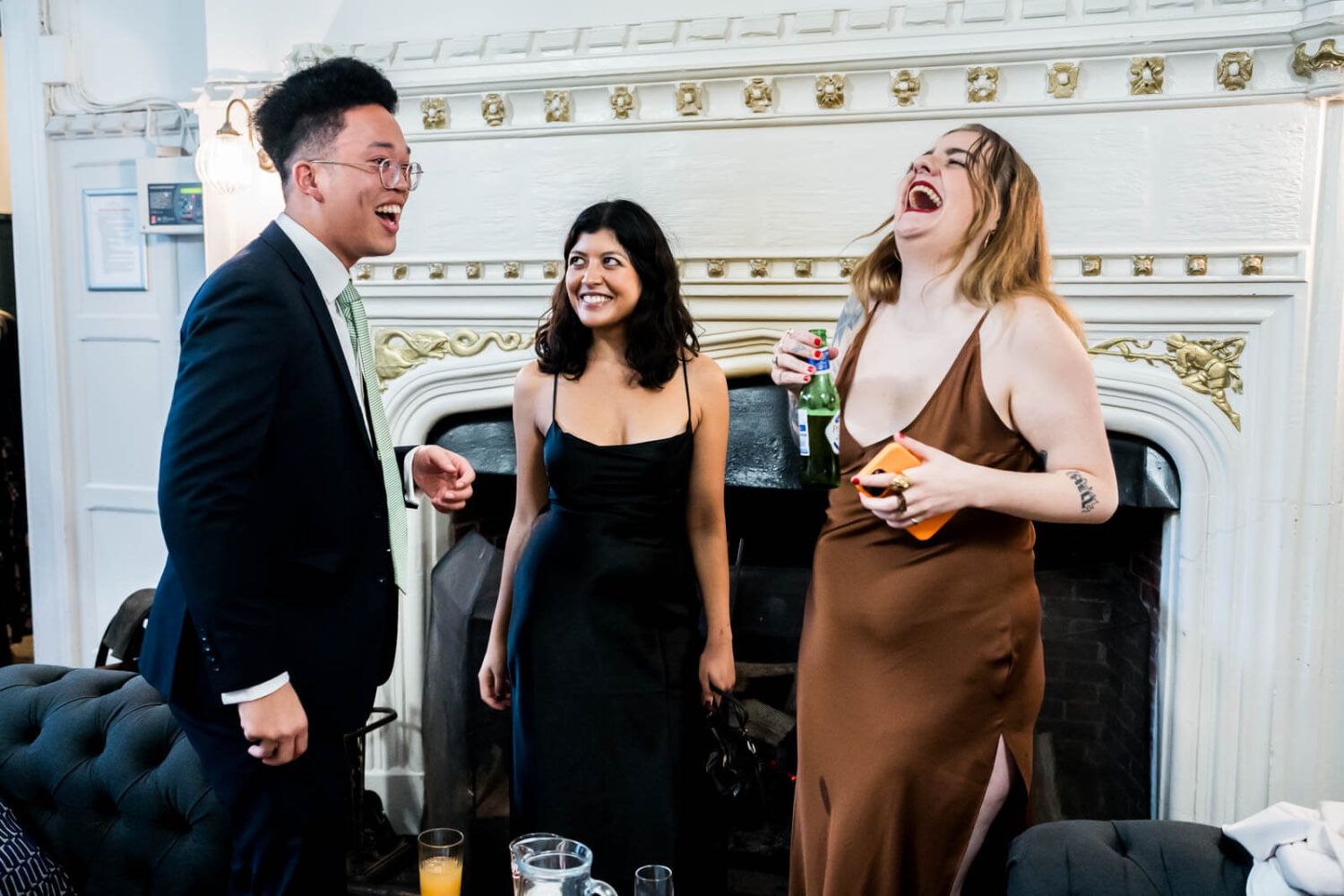 guests laughing at reception drinks at highley manor