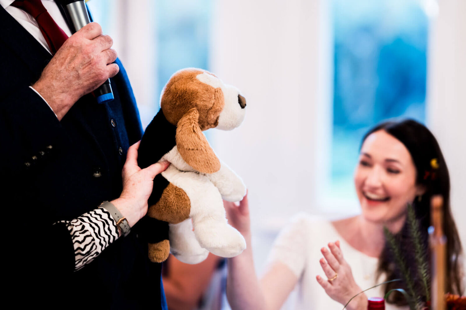 old teddy belonging to the bride being handed over to her
